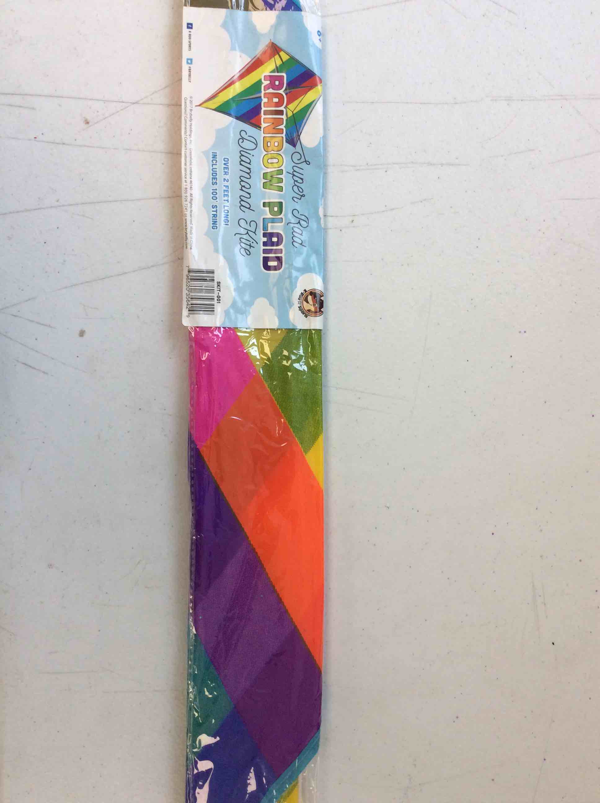 Condition photo showing New/Like New for super rad rainbow plaid diamond kite