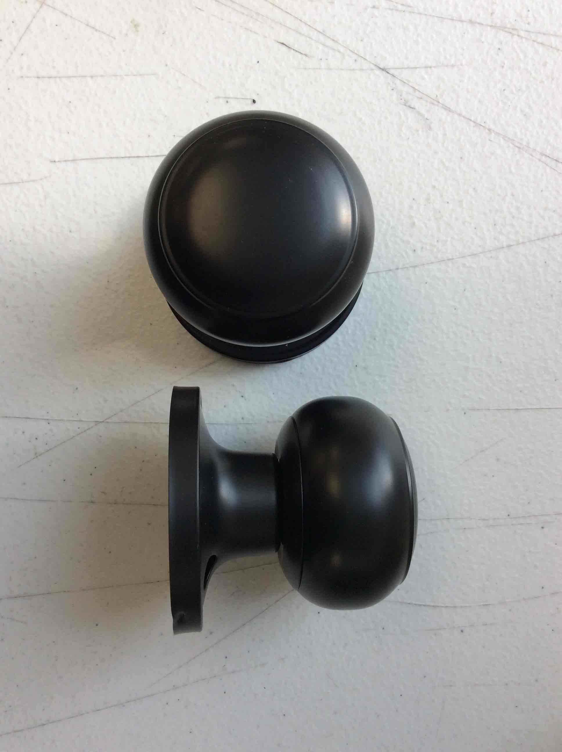 Condition photo showing New/Like New for black door knobs 