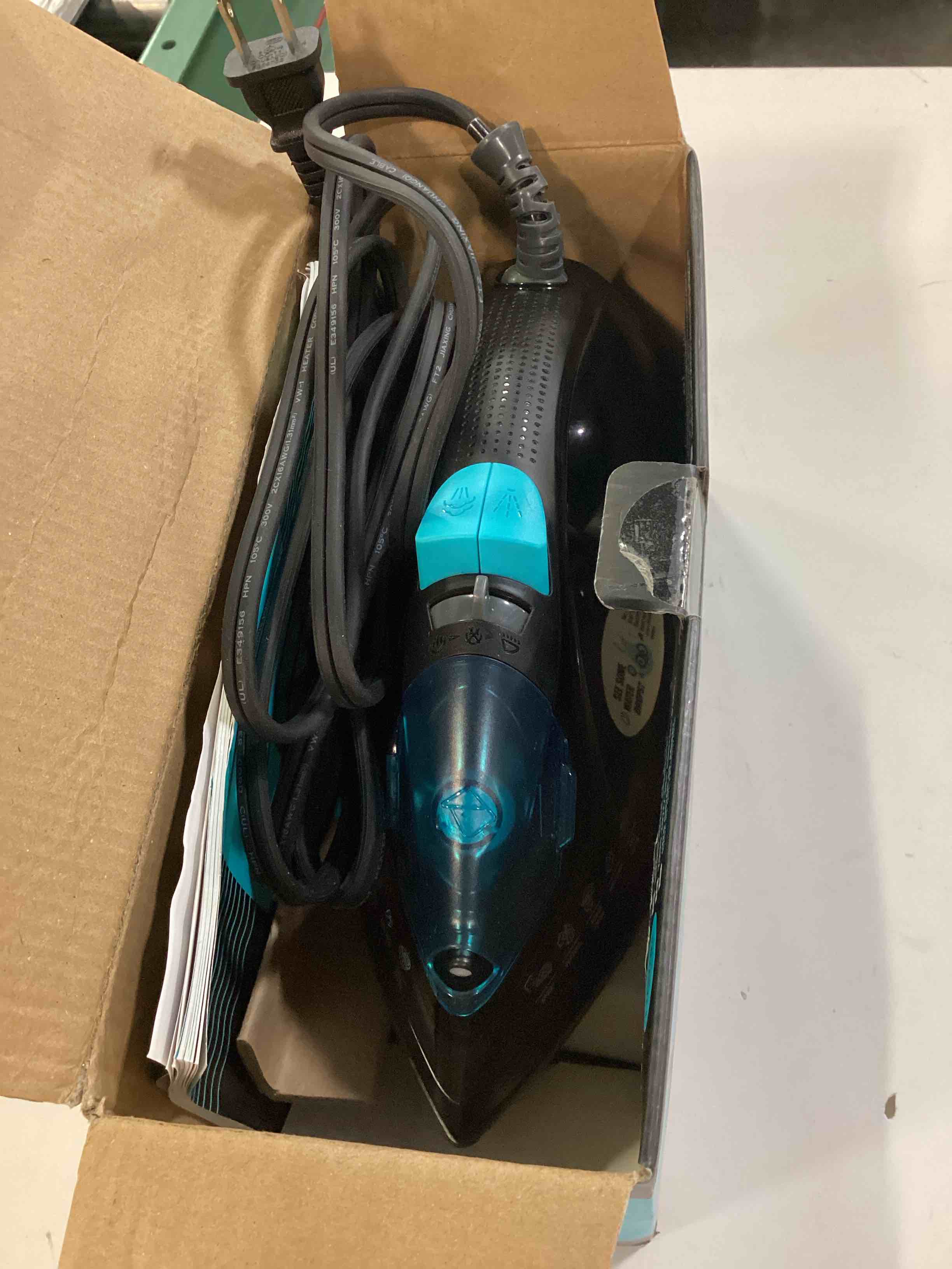 Condition photo showing As Is for pursteam steamlite steam iron with non-stick soleplate, auto shut-off | 1250 w | powerful steam | burst of steam | spray | non-stick soleplate | easy temperature control | auto shut-off