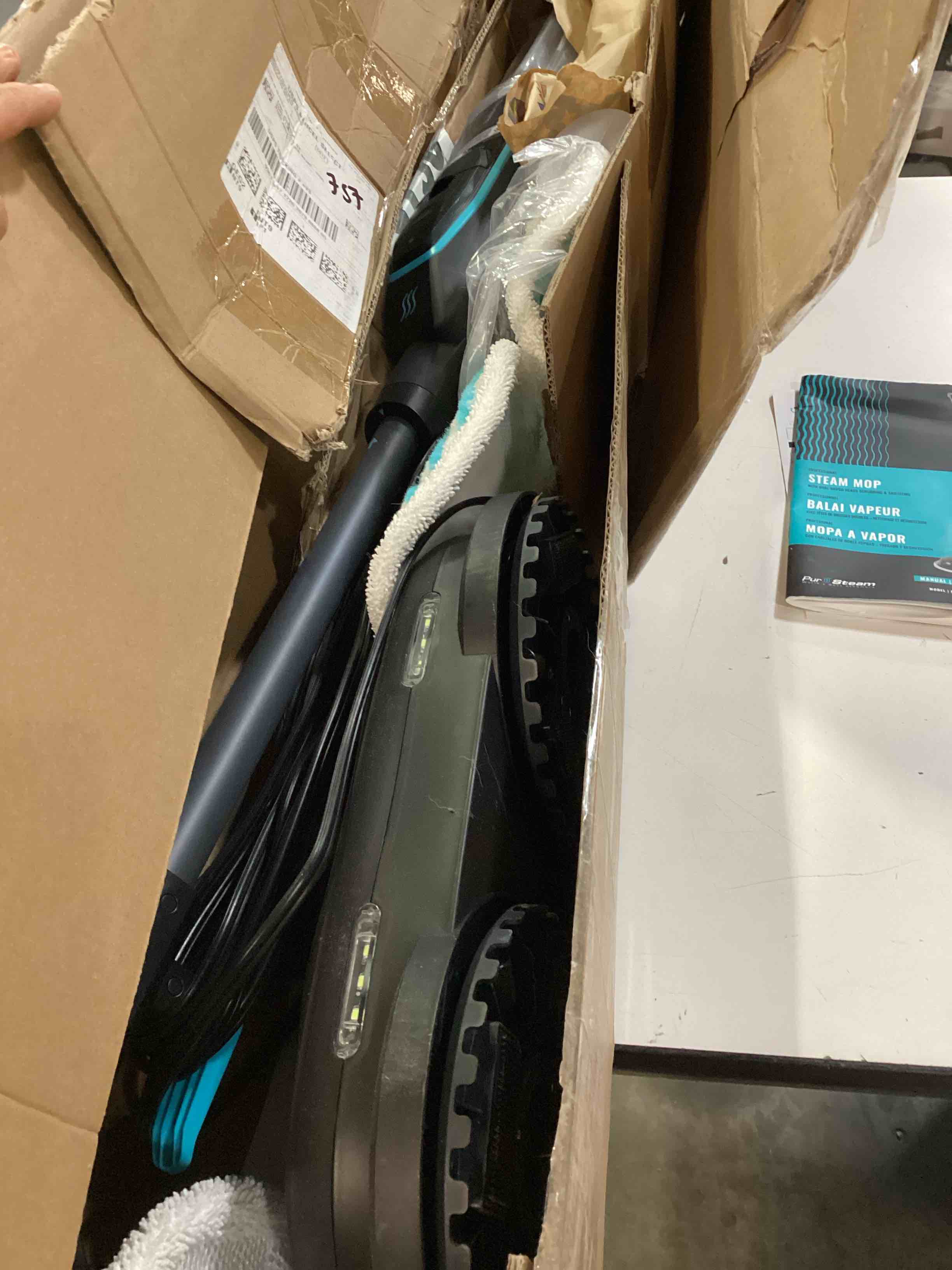 Condition photo showing As Is for pursteam scrubmaster steam mop with dual scrubbing head, led headlights, adjustable steam control, anti-slip swivel head, cable holder & upright lock scrub master