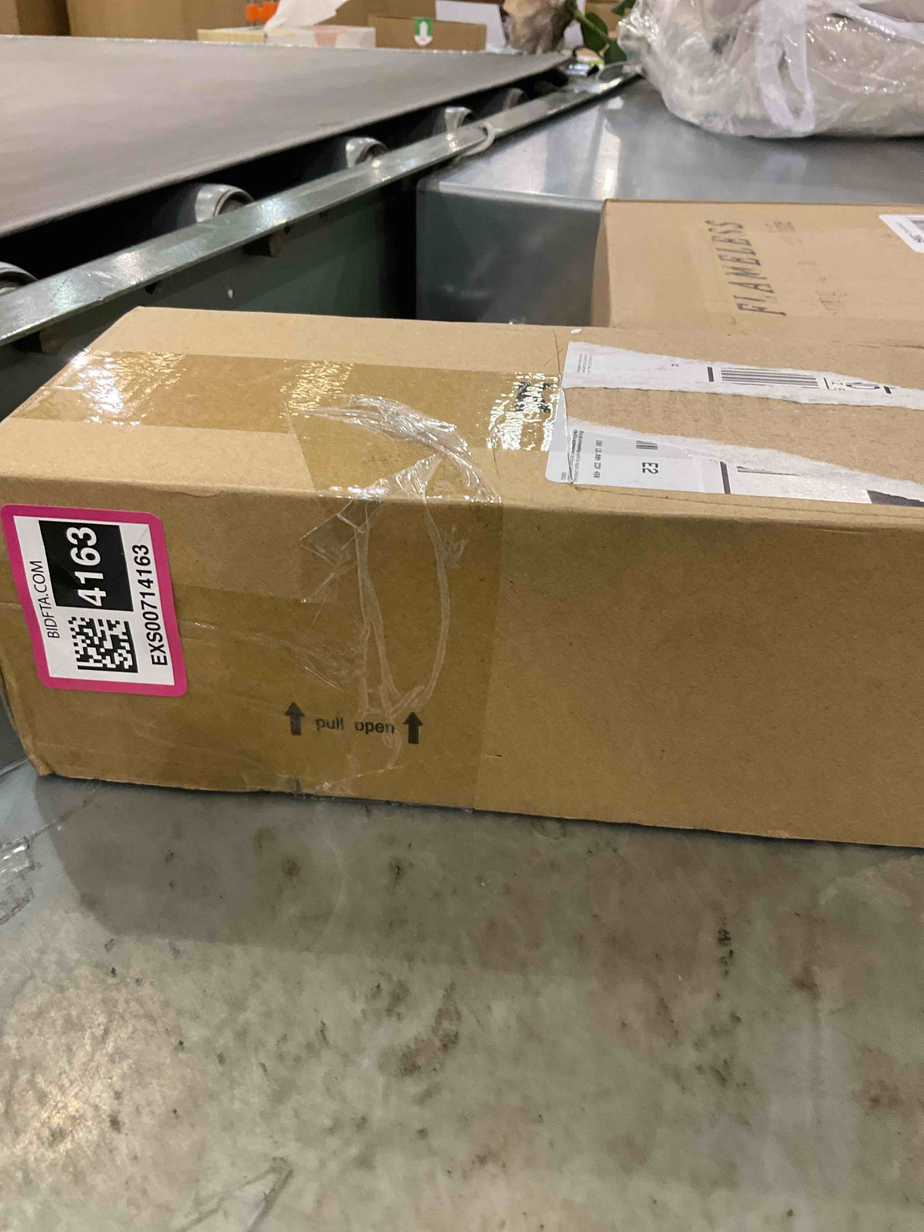 https://s3.amazonaws.com/lotting-images-prod/bidfta/EXS00714163_1703181867155.jpeg