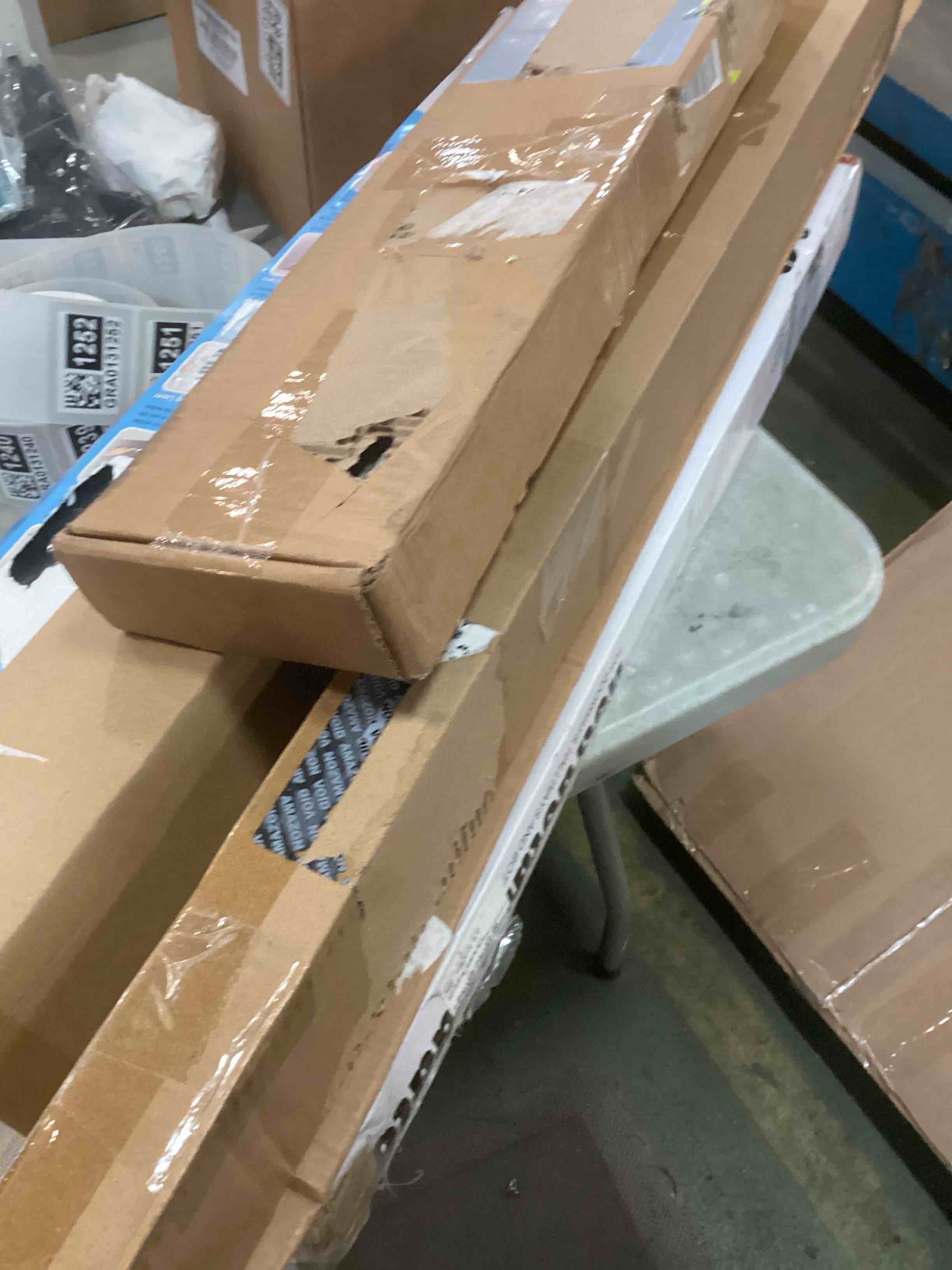 Assortment of Miscellaneous products (May Include cordless shade, curtain rods, retractable baby gate, Led universal linear lamp and more or other use)