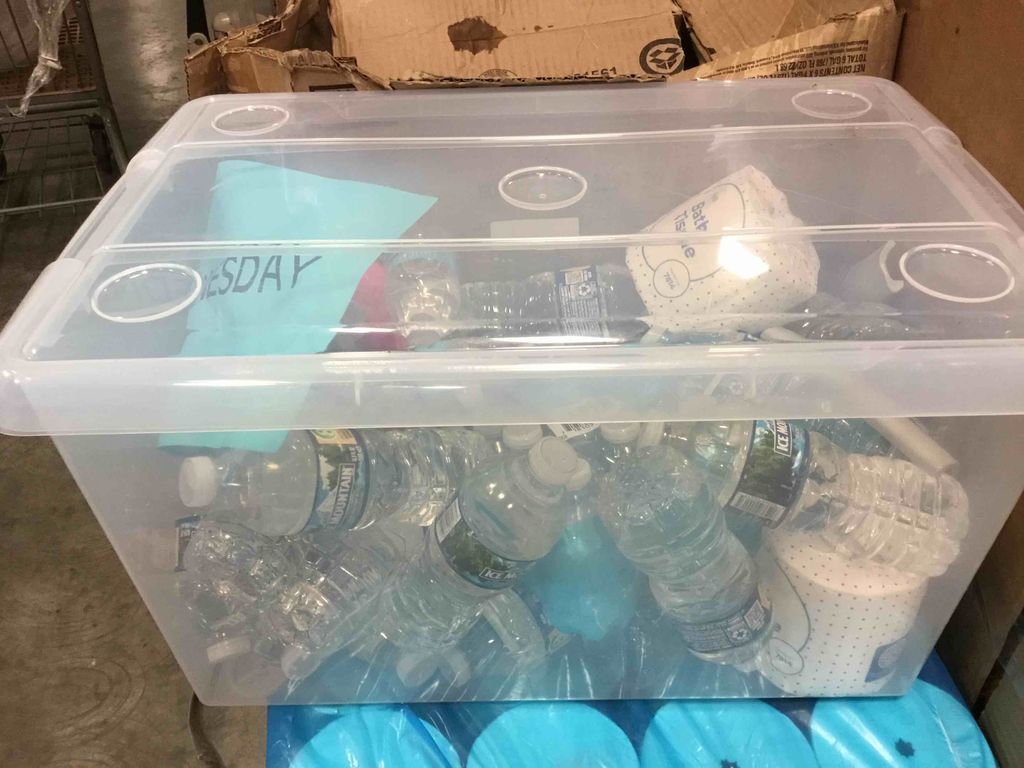 box lot of bottled water and bath tissues