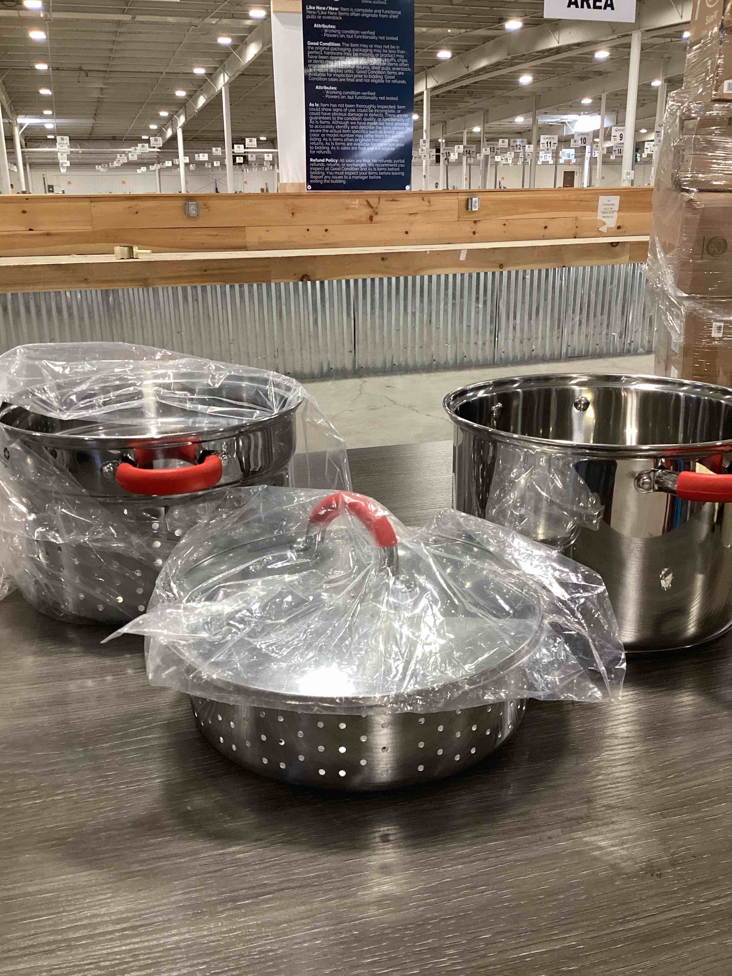 Condition photo showing New/Like New for for 12 qt. stainless steel multi-cooker pasta pot with lid and red silicone handles