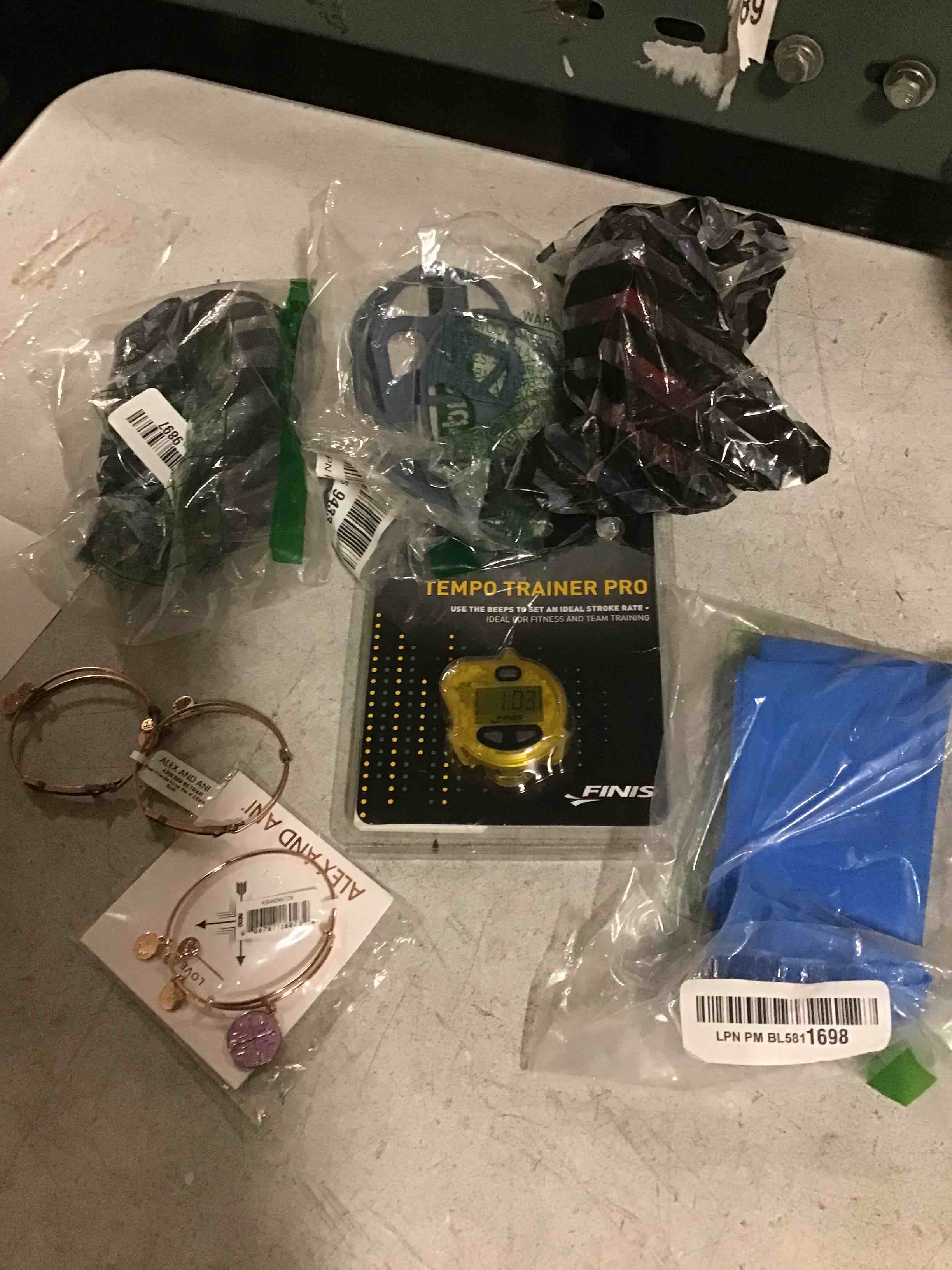 Lot of 7 different products includes Tempo trainer pro, jewelry, cell phone accessories and more