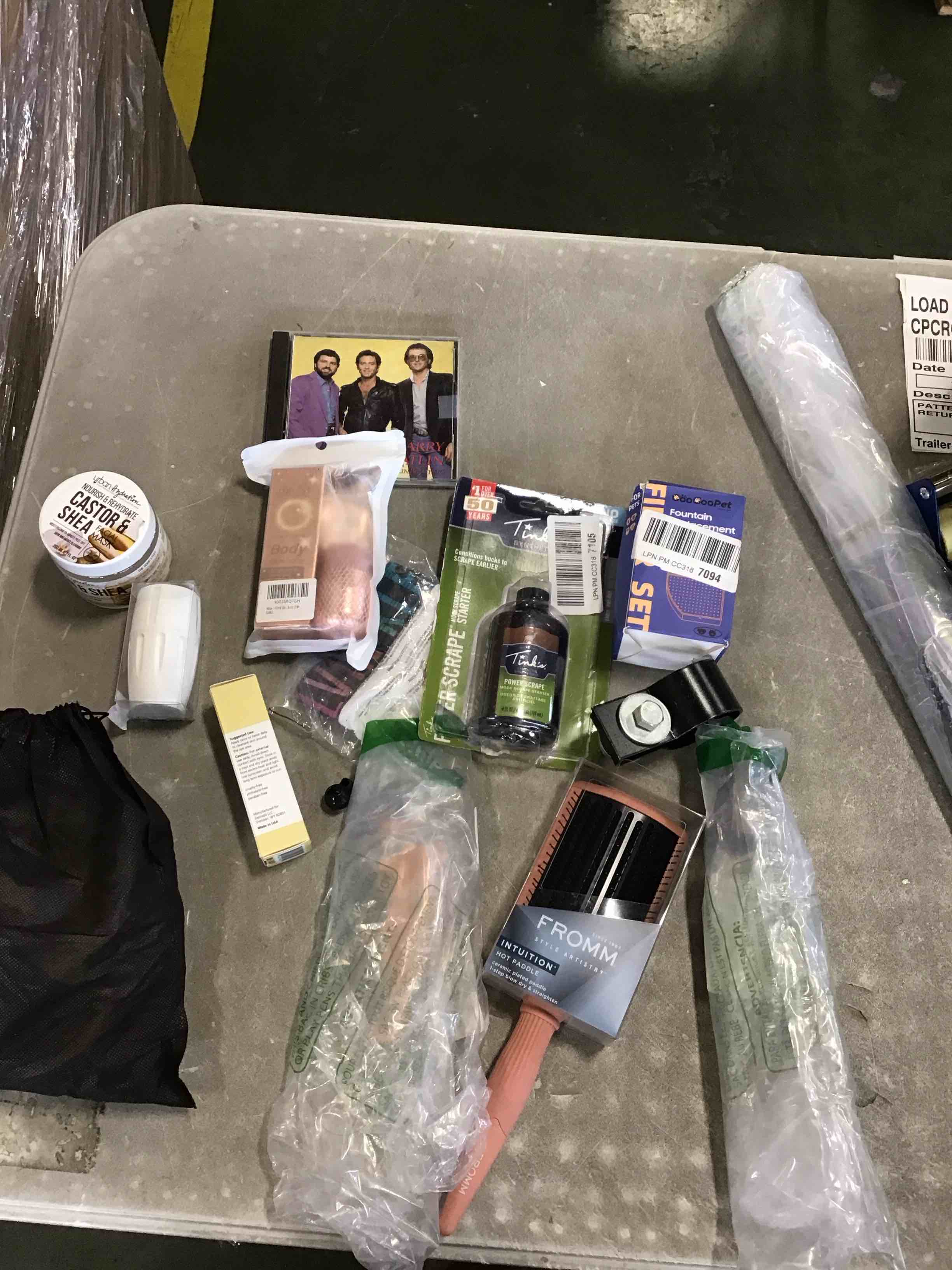 Assorted different products includes women's hair comb, highlighter, eye gel, castor oil and more. (( Styles May Vary))