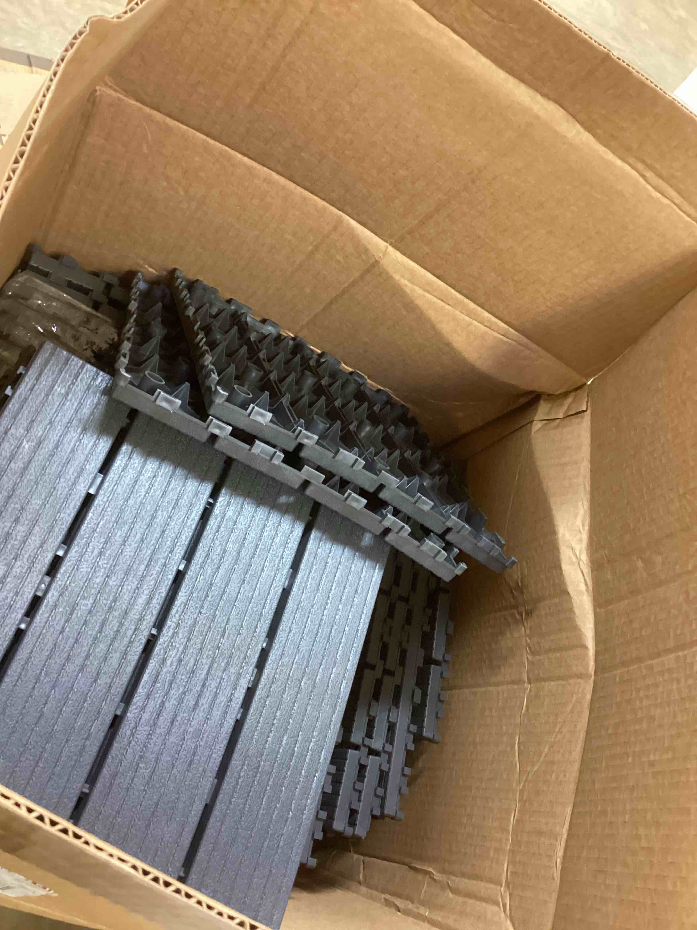 Condition photo showing As Is for Dark Gray 1 ft. x 1 ft. All-Weather Plastic Outdoor Interlocking Deck Tiles Striped Pattern Garage Floor Tiles(44-Pack)