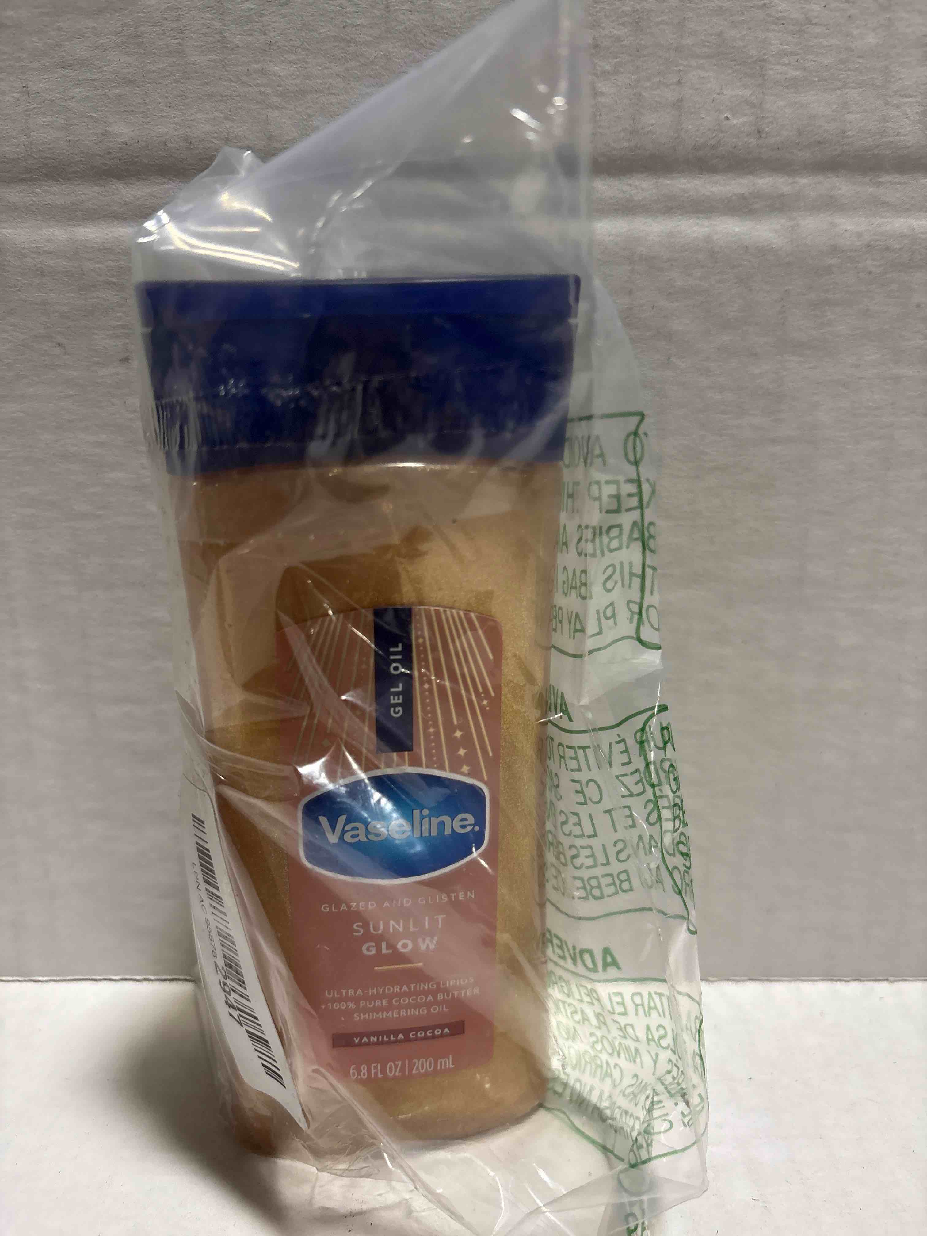 Condition photo showing New/Like New for Vaseline Glazed and Glisten Sunlit Glow Body Gel Oil Vanilla Cocoa Shimmering with Ultra-Hydrating Lipids and 100% Pure Cocoa Butter, 6.8 Oz
