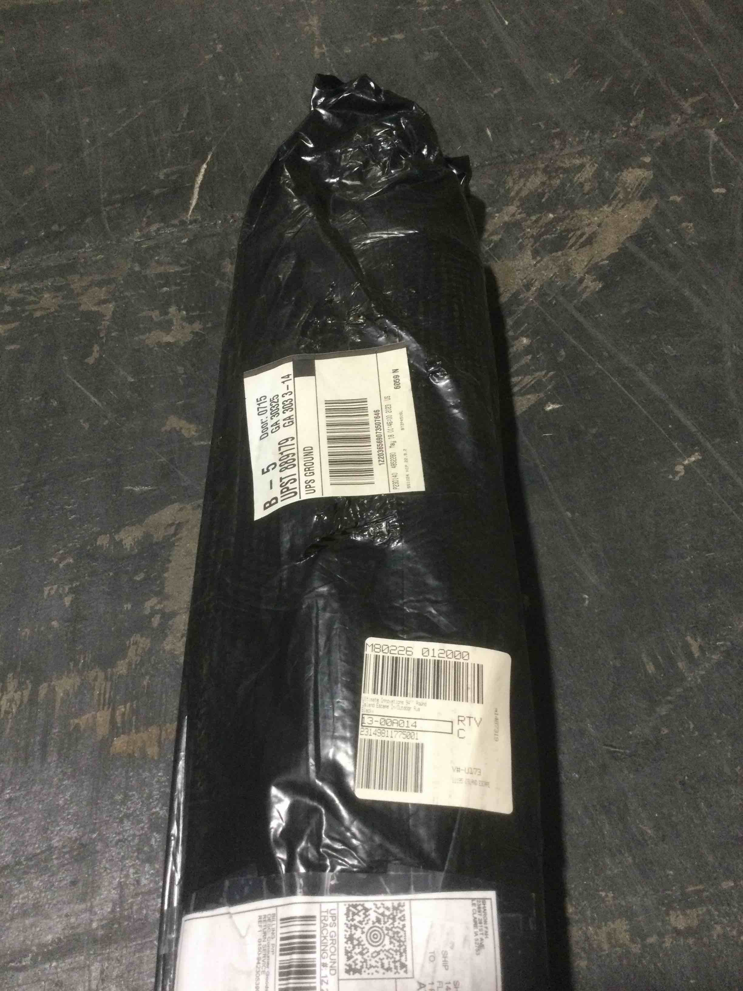 Condition photo showing New/Like New for ultimate innovations 94” Round island escape in/outdoor rug, black 