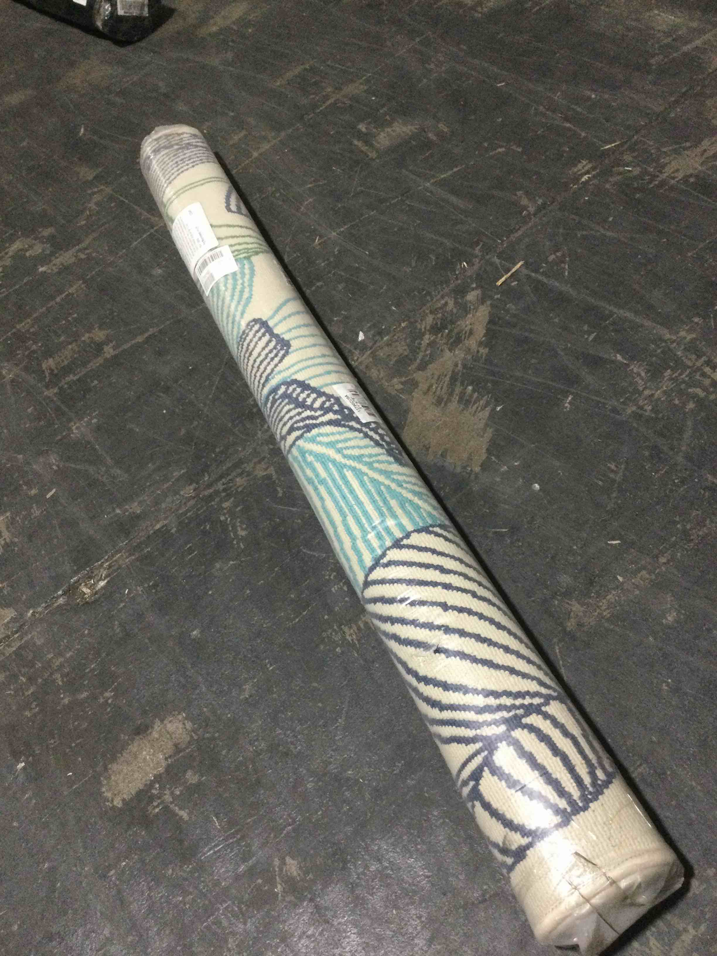 Condition photo showing New/Like New for ultimate innovations tropical palms  5’3”x7’ rug, blue green