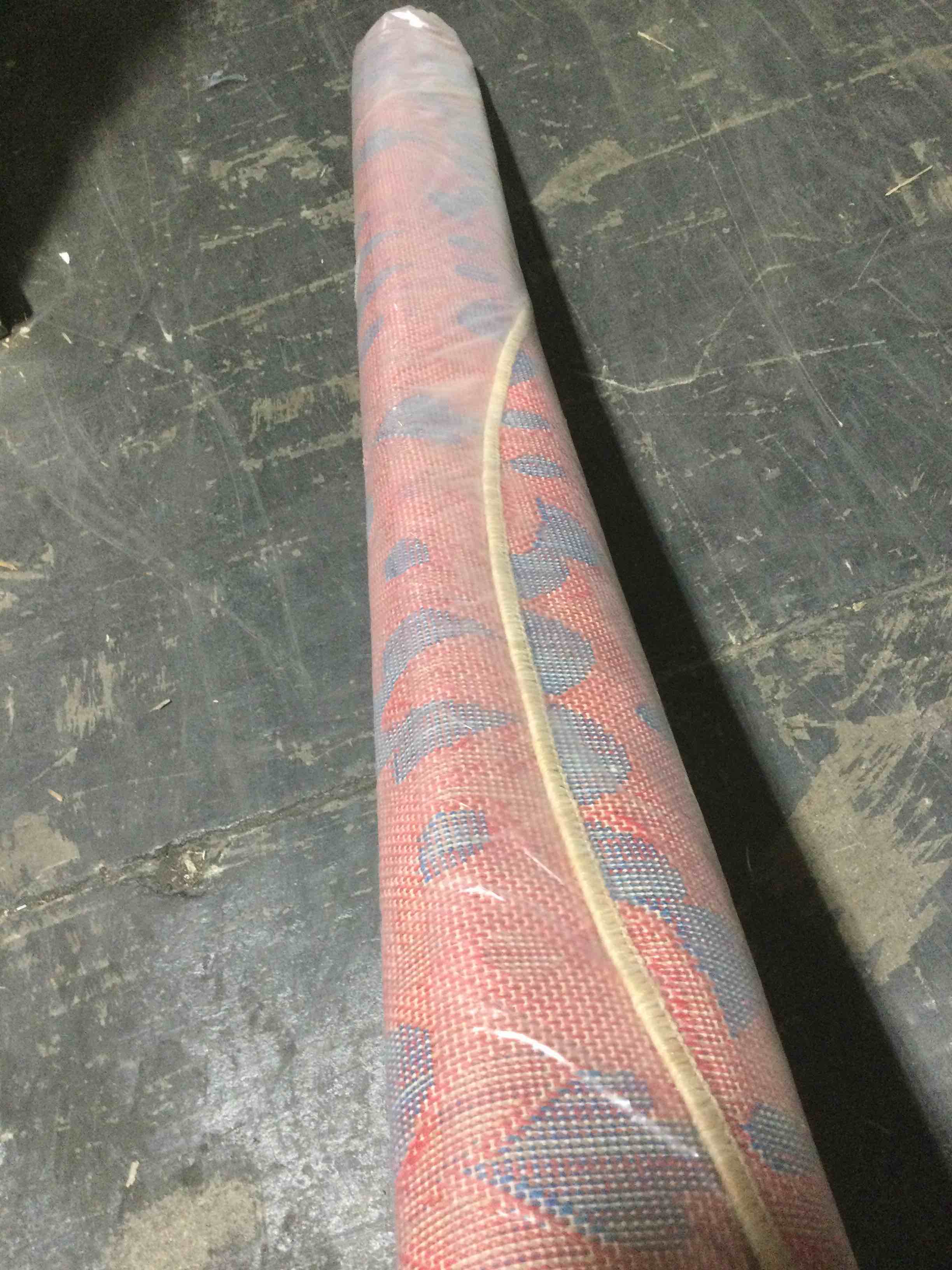 Condition photo showing New/Like New for ultimate innovations California villa 94’ round in/outdoor rug, pink/blue