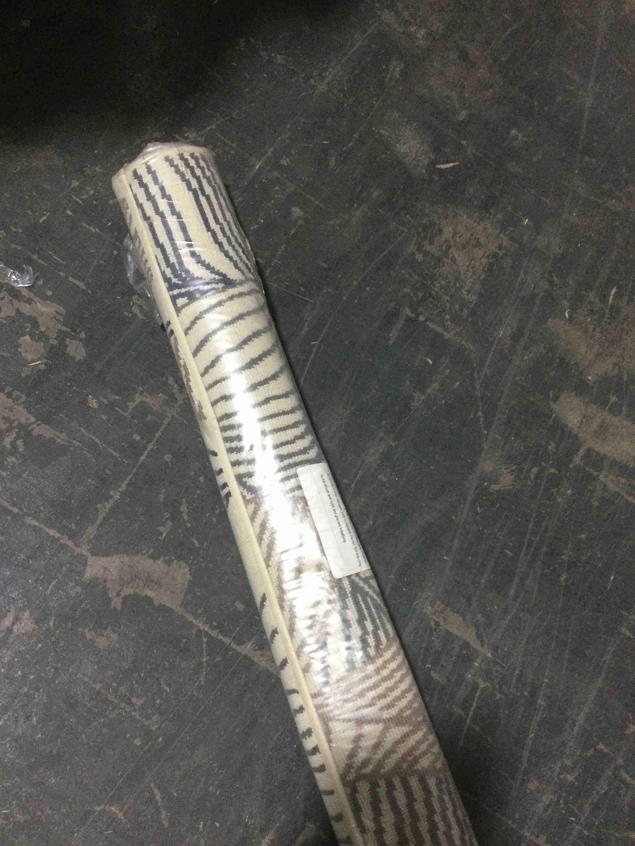 Condition photo showing New/Like New for ultimate innovations tropical palms 5’3”x7’ rug, neutral