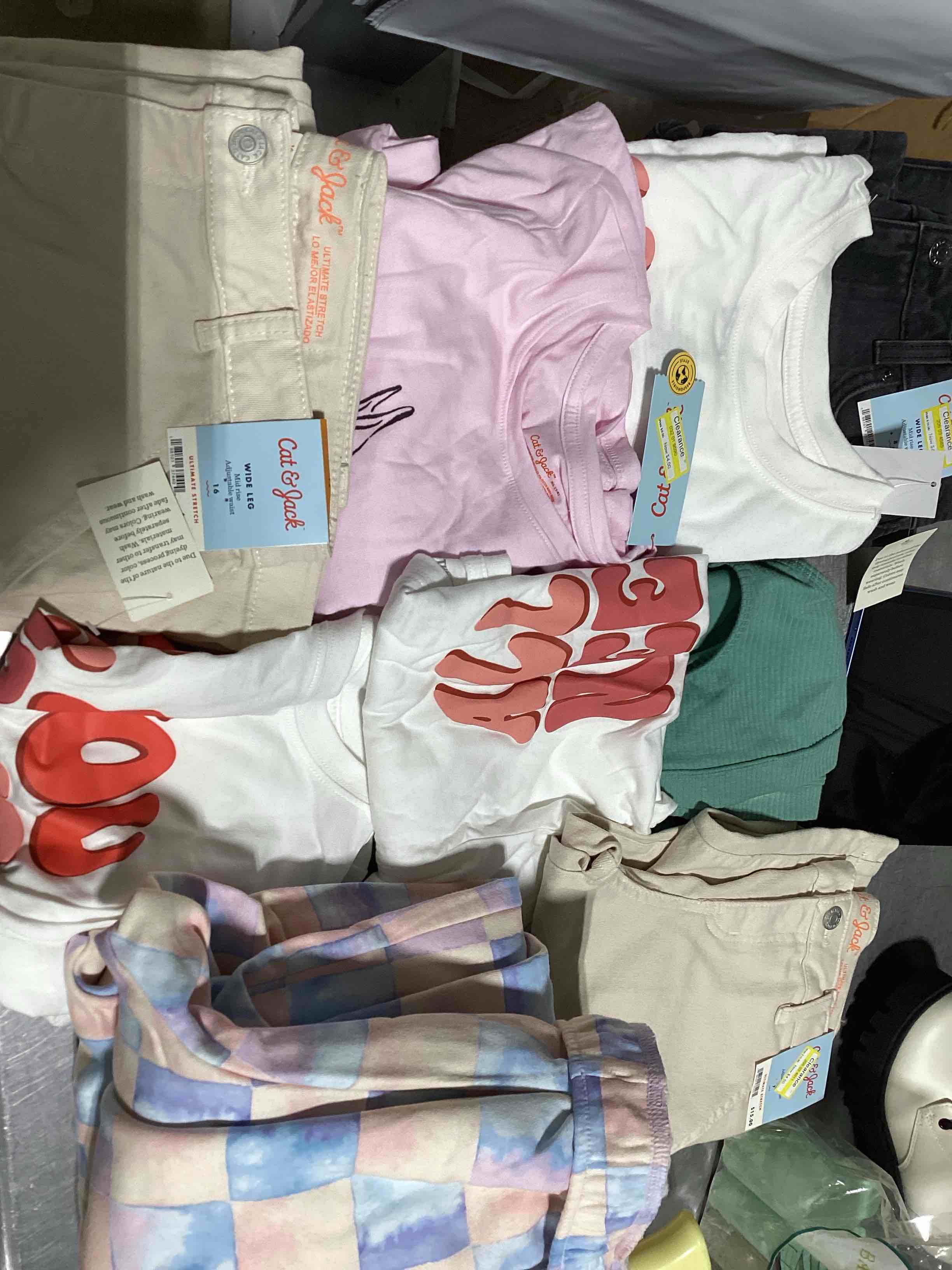 Assorted Clothing different sizes, Color, and Styles.