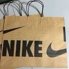 box of Nike swoosh paper retail bags 