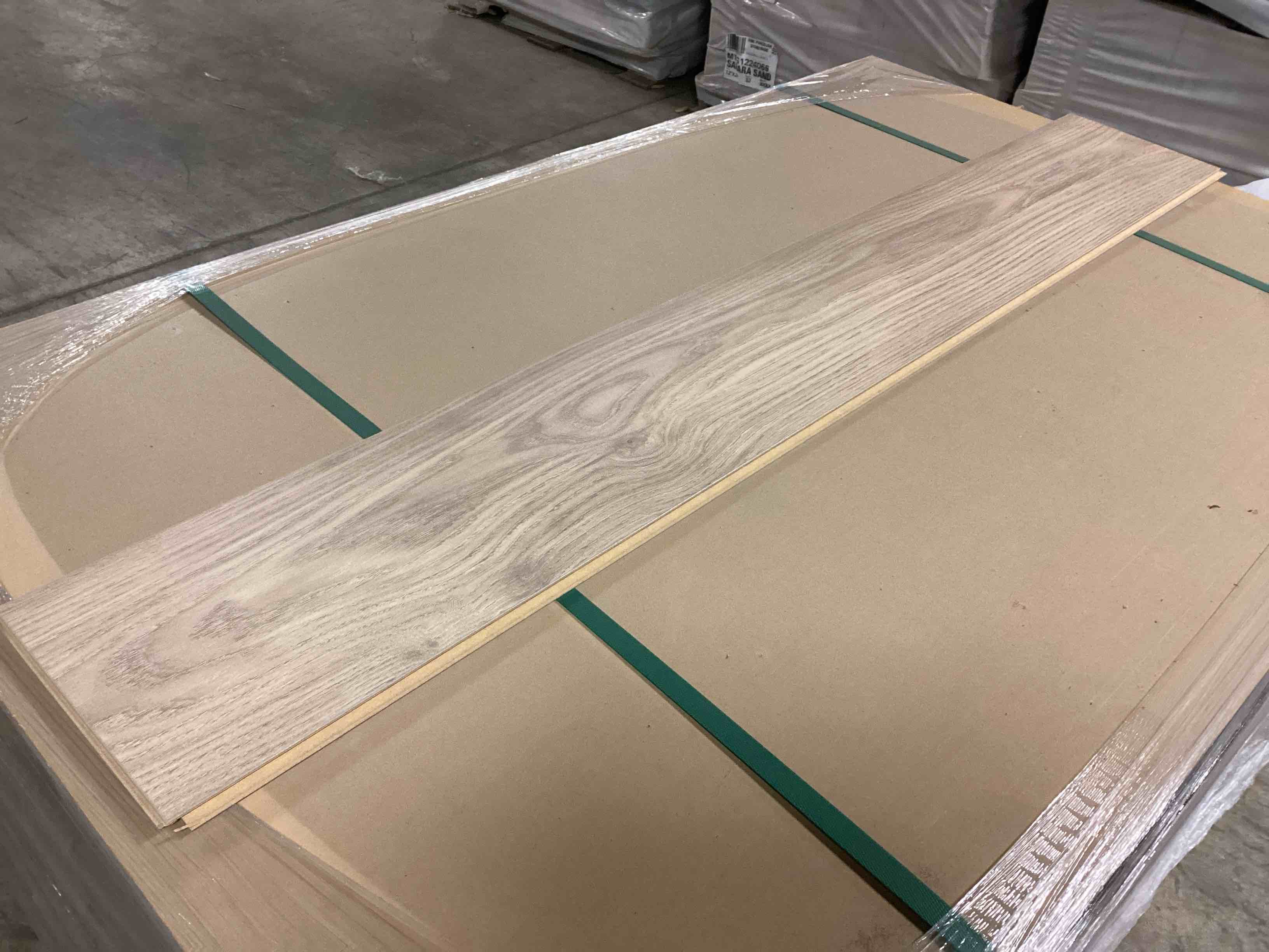 Condition photo showing As Is for 1179.12 sq.ft. of 8mm laminate flooring, your bid per sq.ft