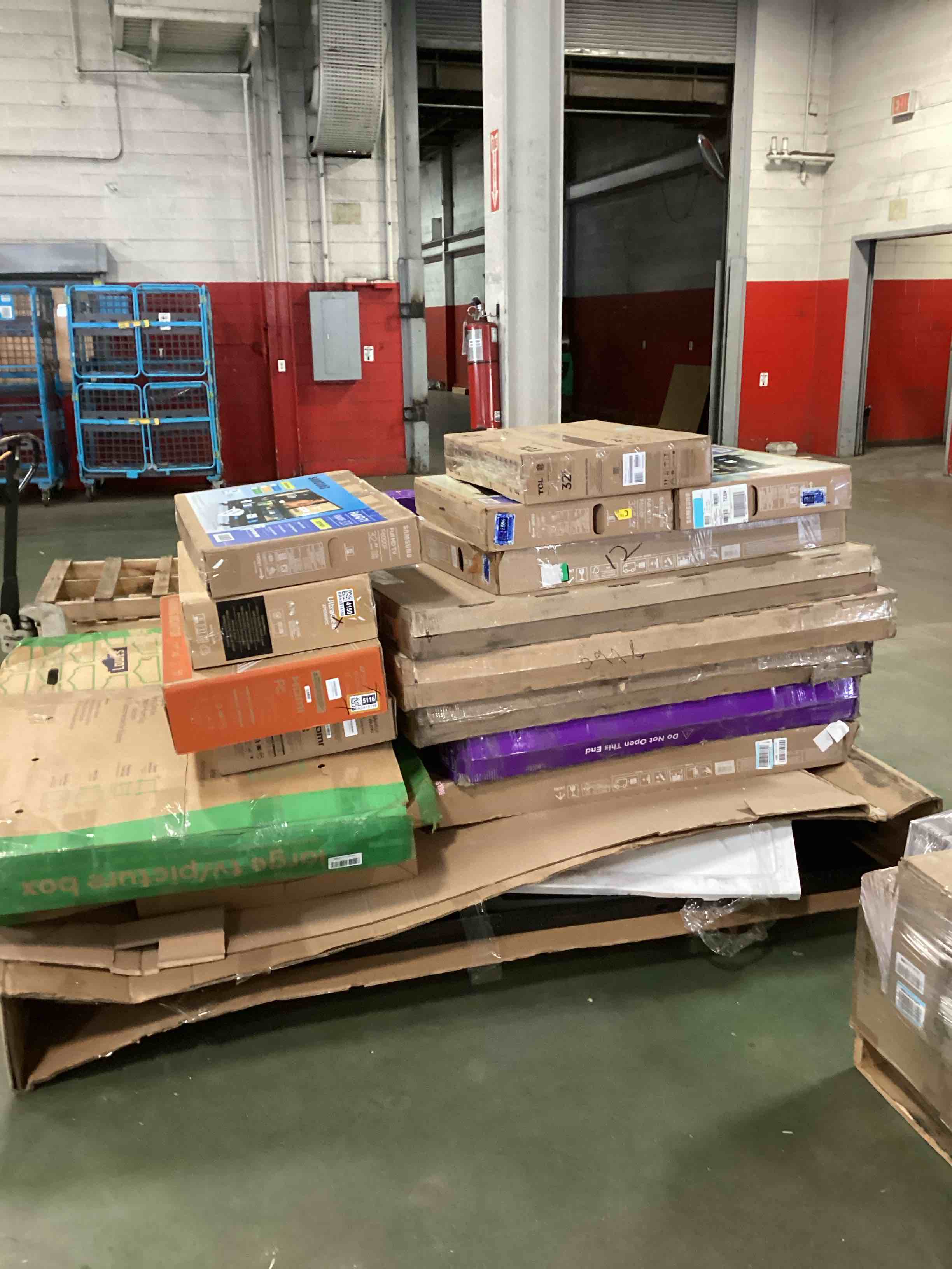 palette of defective electronics for parts 