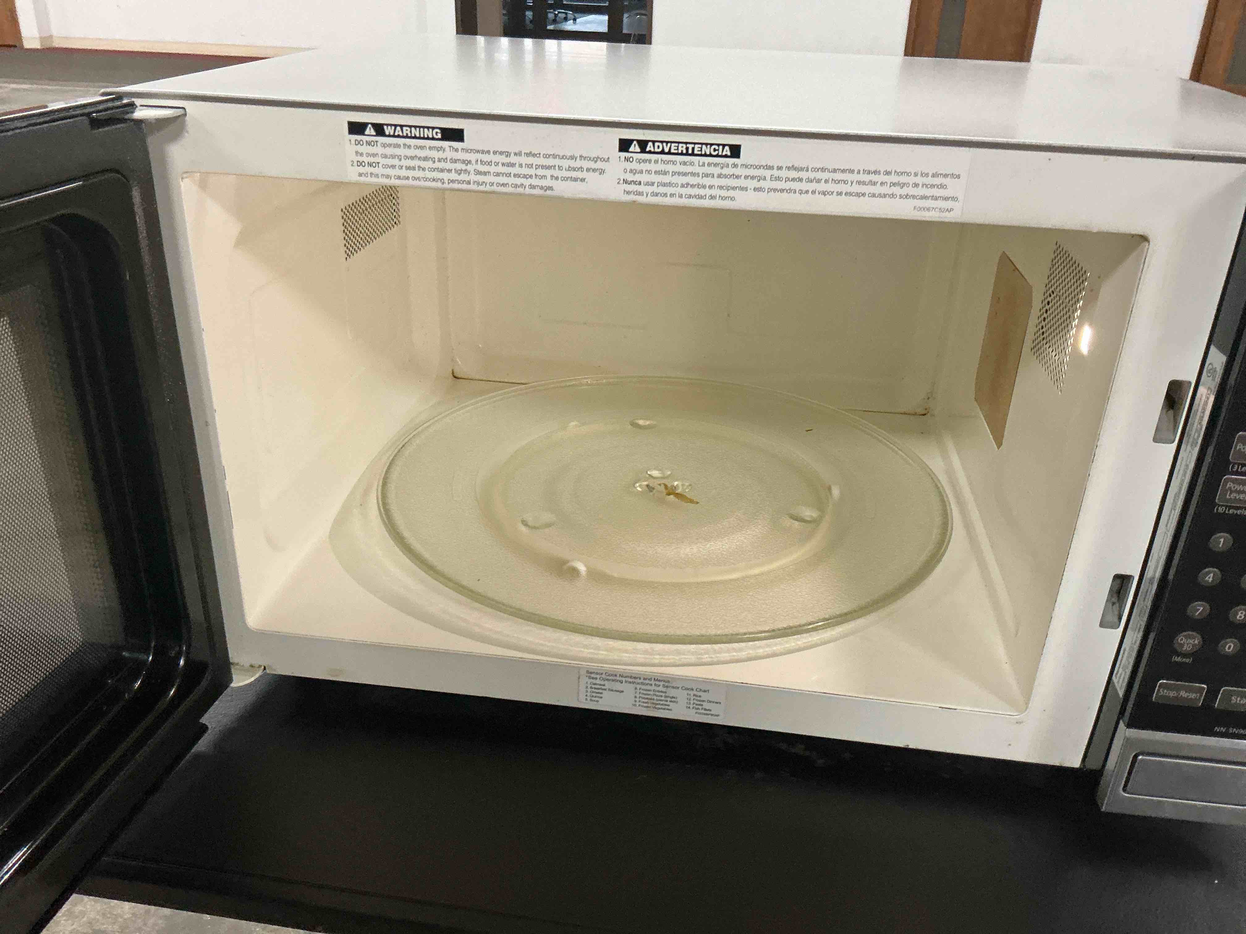 Condition photo showing As Is for Panasonic Microwave Oven NN-SN966S Stainless Steel Countertop/Built-In with Inverter Technology and Genius Sensor, 2.2 Cubic Foot, 1250W & Nordic Ware Deluxe Plate Cover