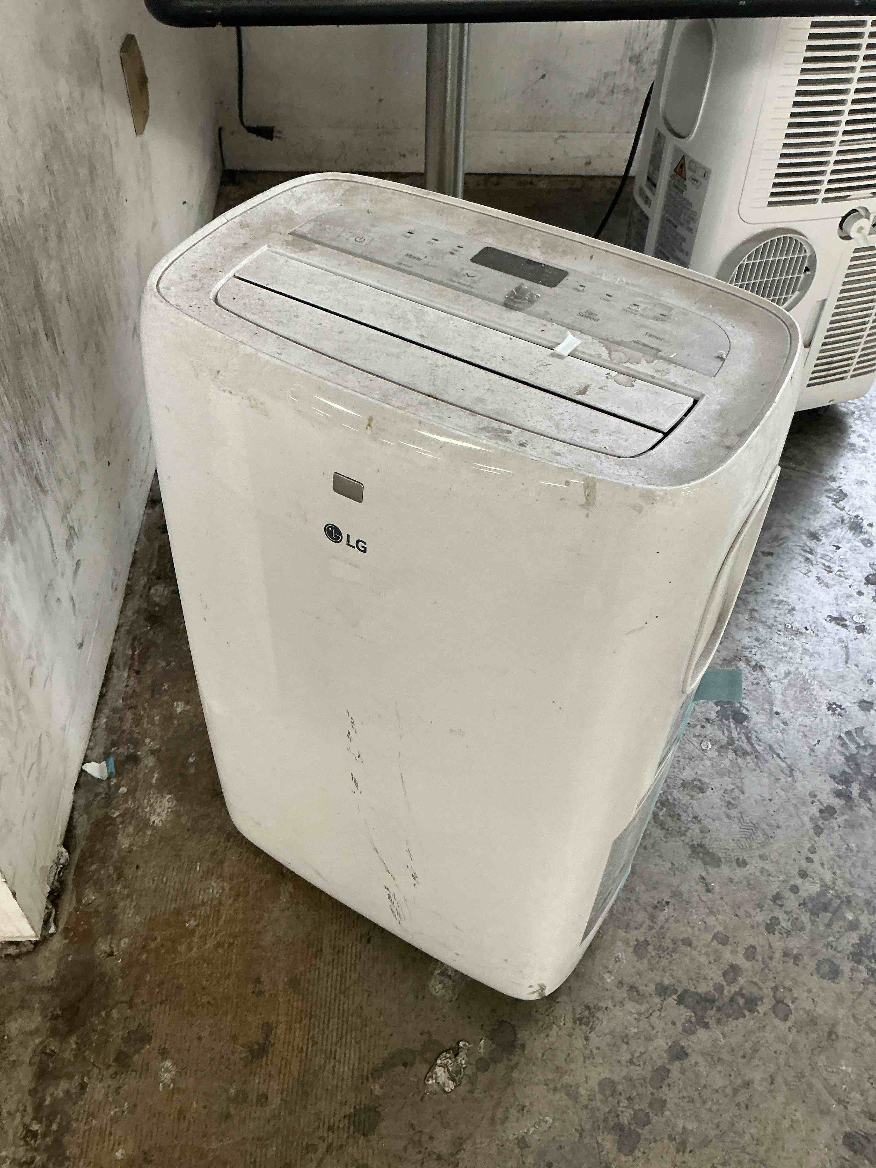 Condition photo showing As Is for LG 7,000 BTU Portable Air Conditioner, 115V, Cools 300 Sq.Ft. (12' x 25' Room Size), Portable Air Conditioner for Home with Quiet Operation, LCD Remote Control, and Window Installation Kit, White Up to 300 Sq. Ft. Cool Only White