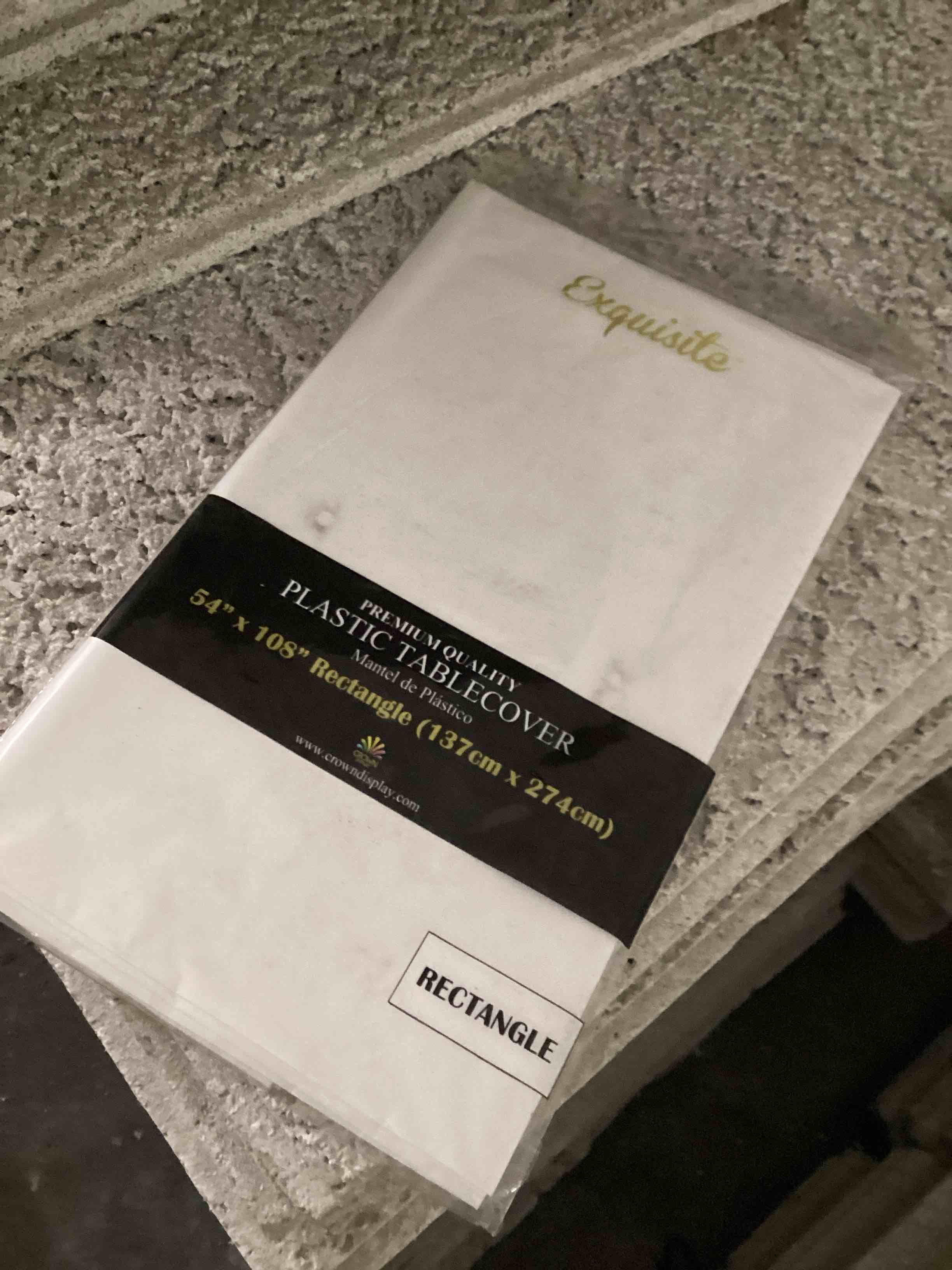 Condition photo showing New/Like New for *Premium* White Plastic Table Cover - 54 in. x 108 in. Disposable Tablecloth