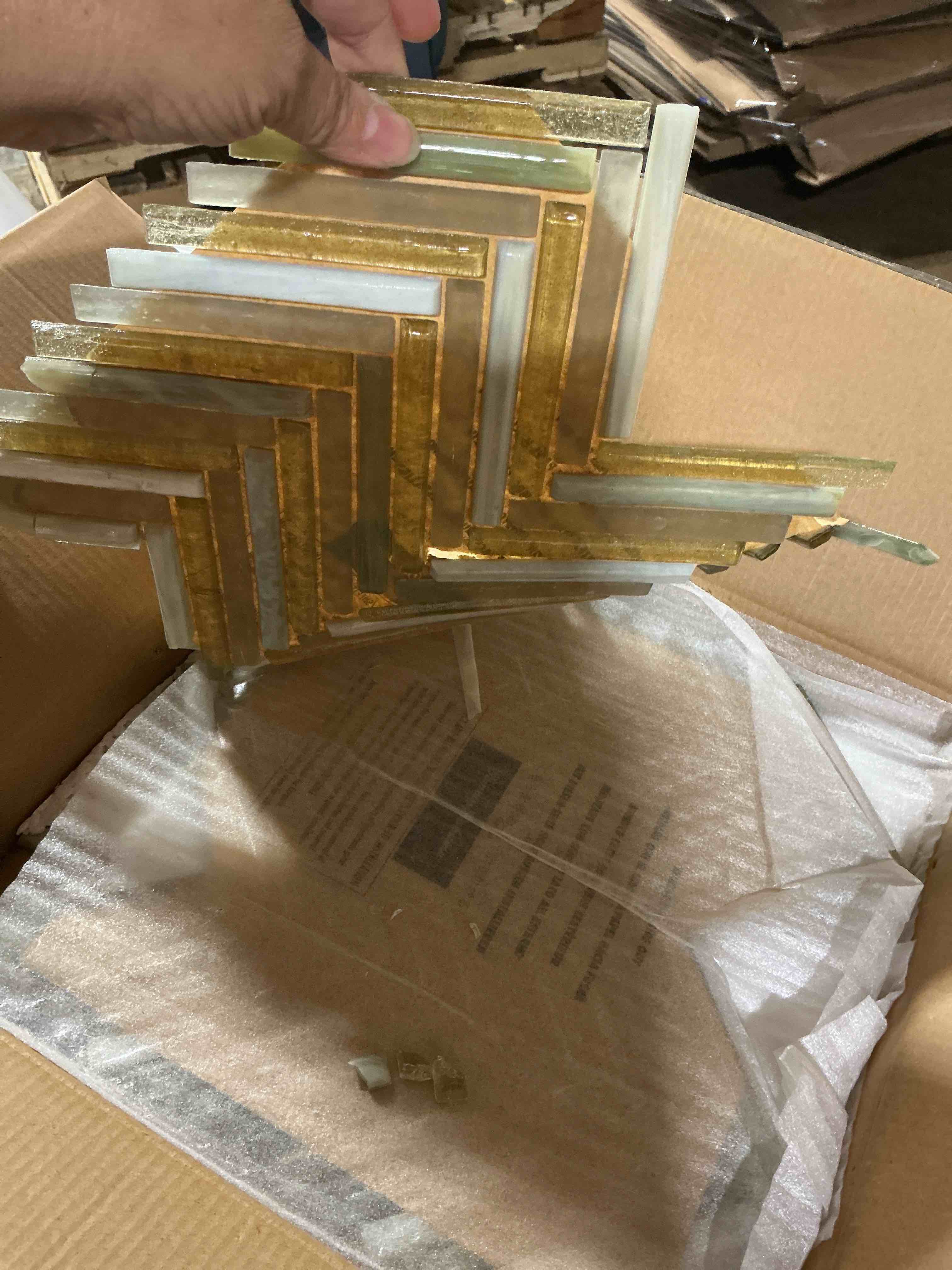 Condition photo showing As Is for tommy bahama 1/2 x 4 socotra mix wall tile (3 pcs)