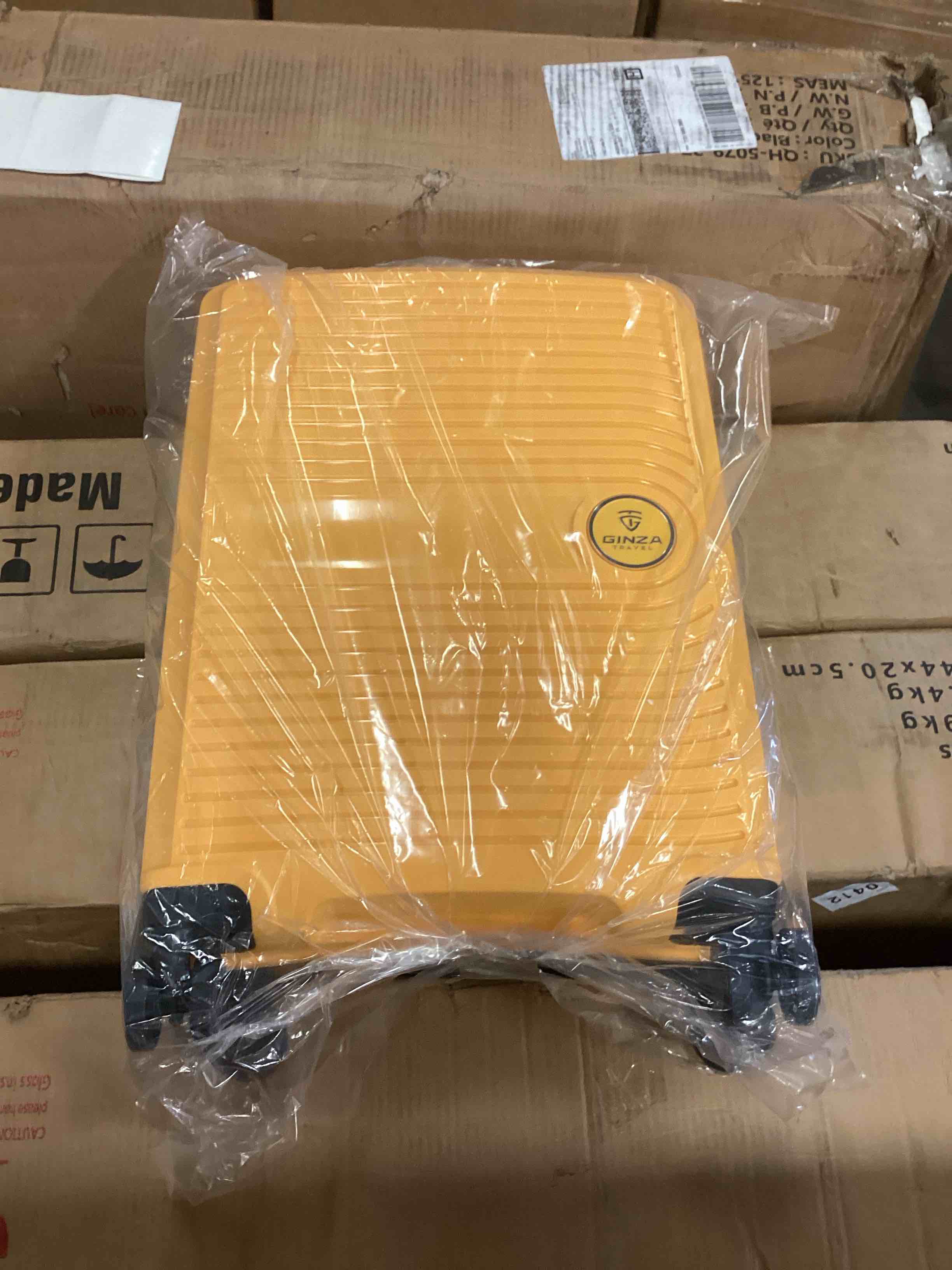 Gina’s Travel Yellow carry on 