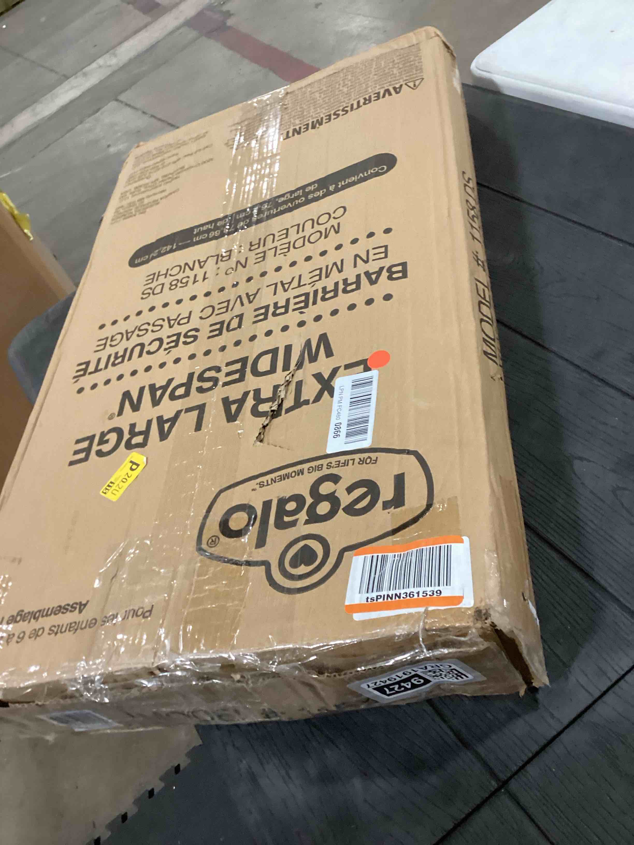 Condition photo showing As Is for Regalo 56-Inch Extra WideSpan Walk Through Baby Gate, Includes 4-Inch, 8-Inch and 12-Inch Extension, 8 Piece Set - 4 Pack of Pressure Mounts and 4 Pack of Wall Cups and Mounting Kit, White White 29-56"W x 30"H