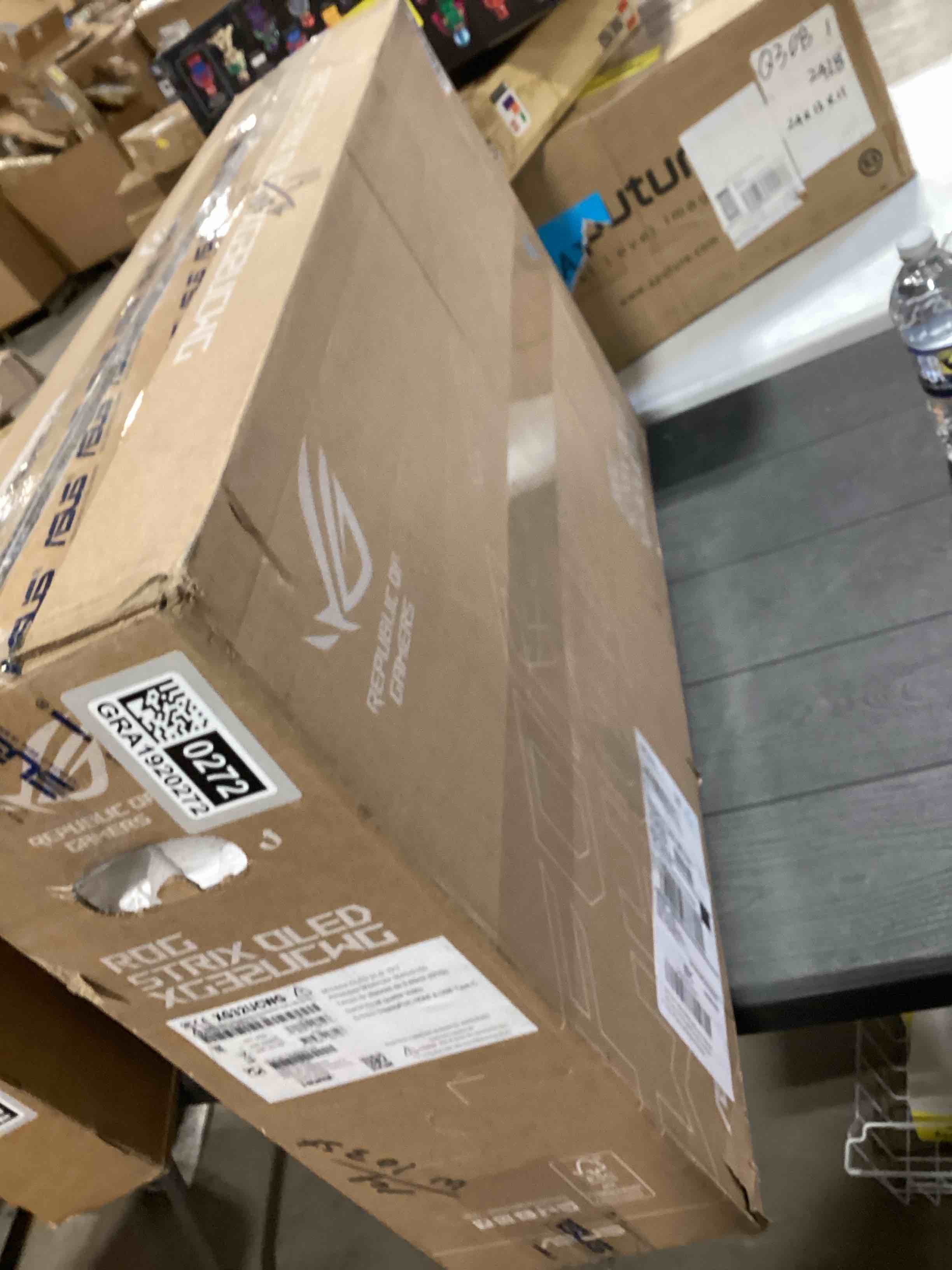 Condition photo showing As Is for ASUS ROG Strix 32” 4K OLED Gaming Monitor (XG32UCWG) - TrueBlack Glossy OLED, Dual Mode (4K@165Hz, FHD@330Hz), 0.03ms, G-SYNC Compatible, Neo Proximity Sensor, USB-C, HDMI 2.1, 3 yr Warranty