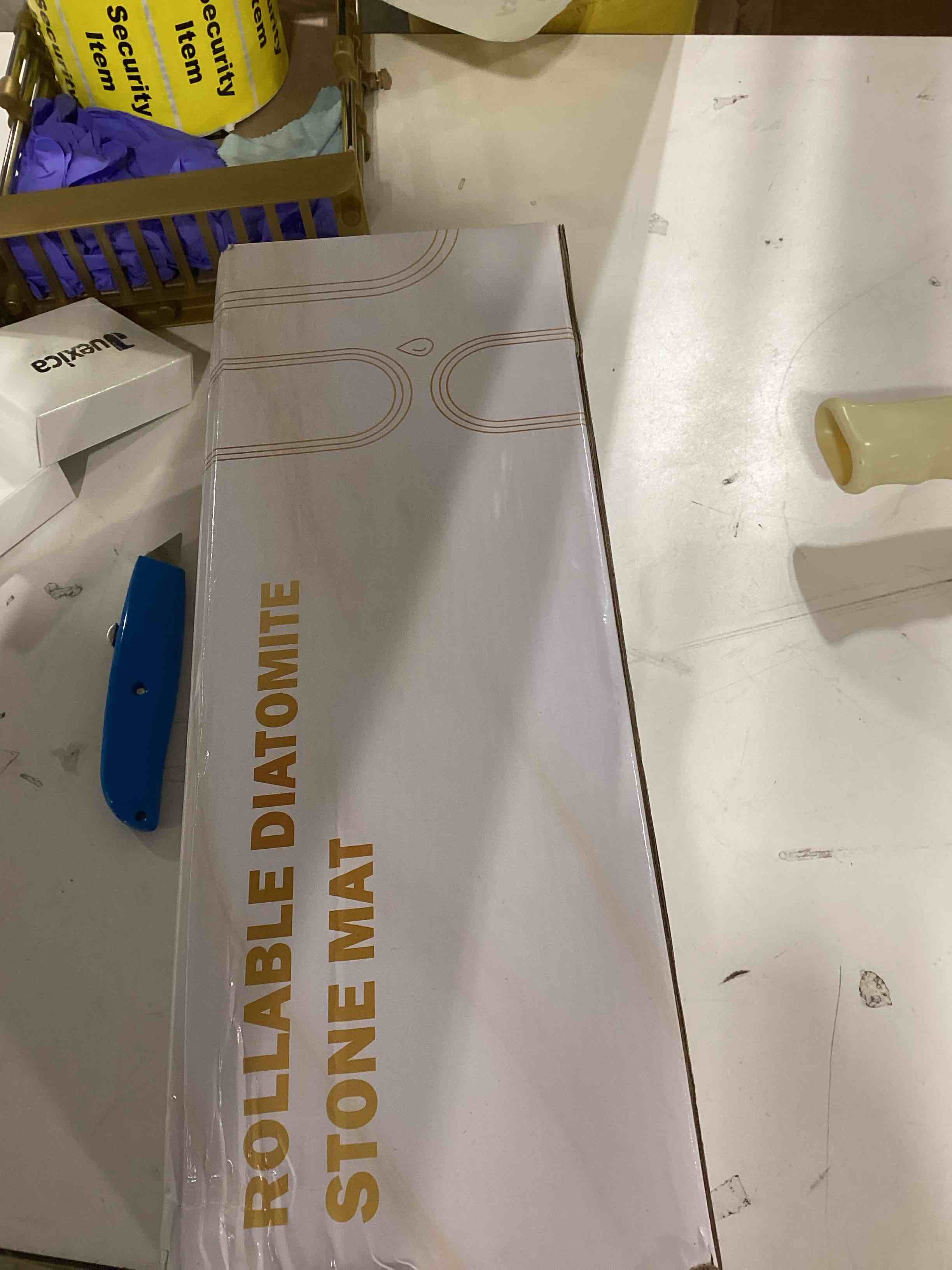 Condition photo showing As Is for Sofort Stone Drying Mat for Kitchen Counter, Super Absorbent Foldable Dish Drying Mat, Gold White Marble Quick Drying Diatomaceous Earth Mats for Dishes, Pots, Utensils Large 24"×16"