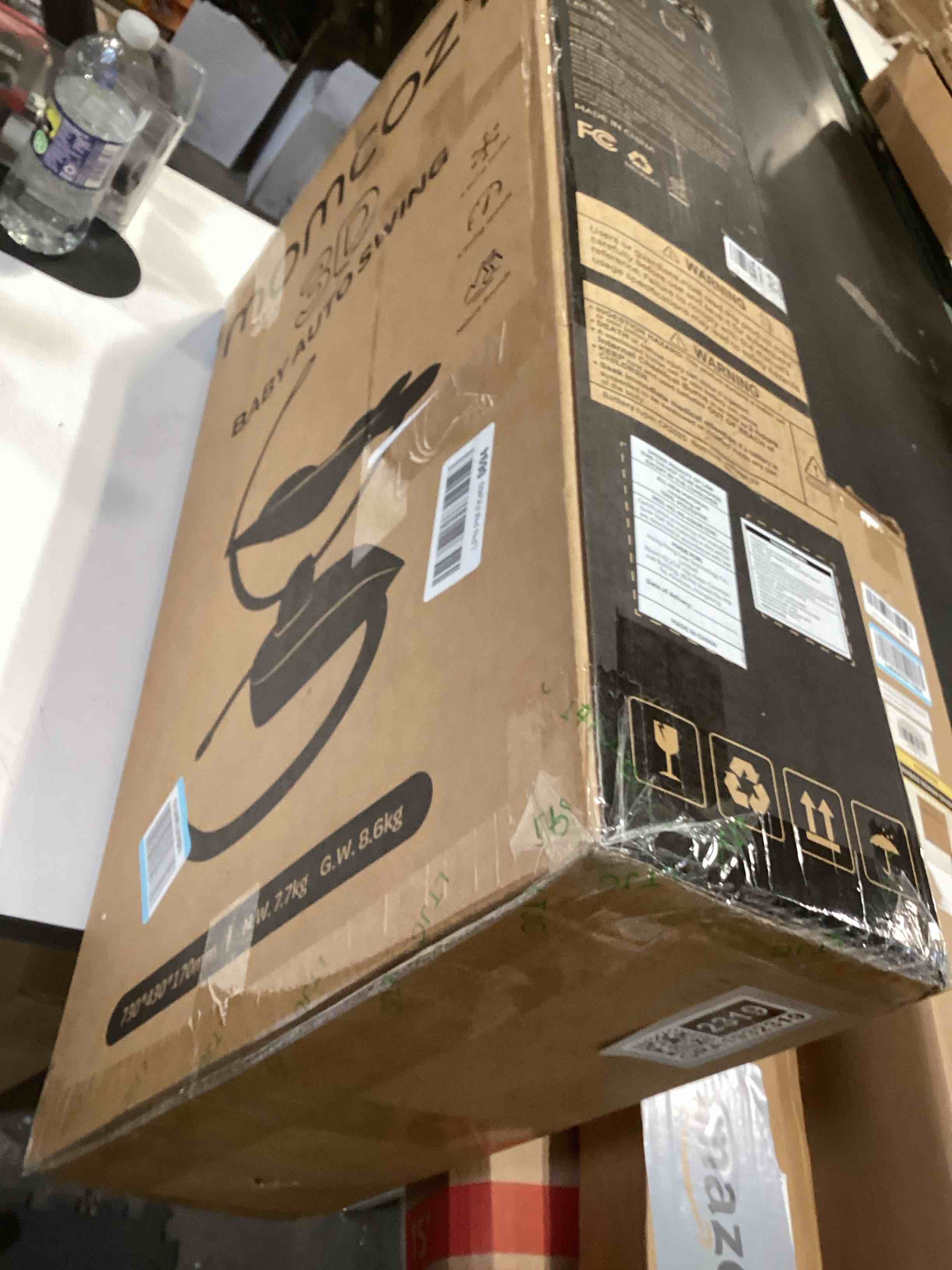 Condition photo showing Good Condition for Momcozy CocoSway Baby Swing for Infants to Toddler, 3D-Motion Electric Baby Swing with 6 Motions & 4-Speeds, Remote Control, Infant Swing with 8 Preset Lullabies for Baby Boy Girl Up to 20 lbs, Haze