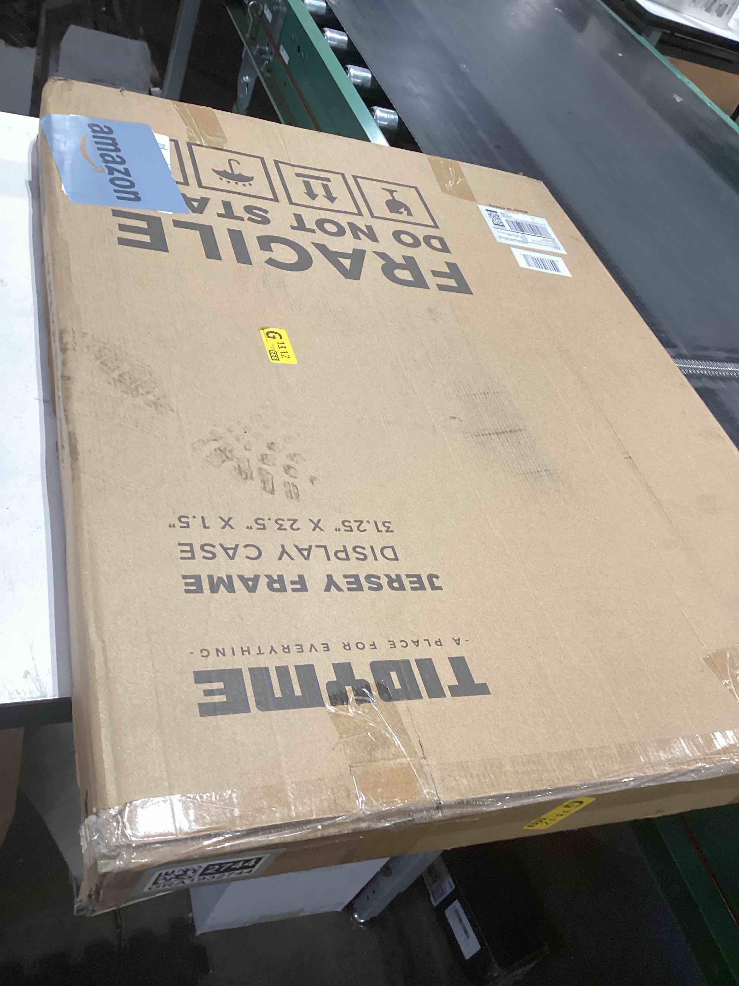 Condition photo showing As Is for Jersey Frame Display Case – Sports Jersey Display Frame with 98% UV Protection for Football, Baseball, Basketball, Hockey, Soccer, Uniform & T-Shirt – Lockable & Durable (Blk/Blk) Black Case & Black Locks