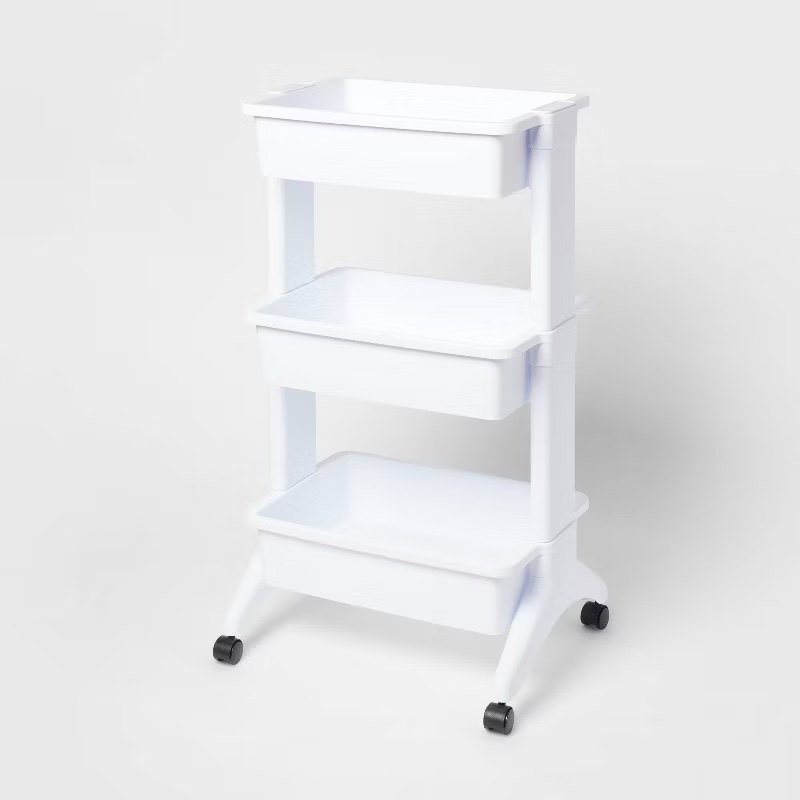 White plastic rolling cart with bins