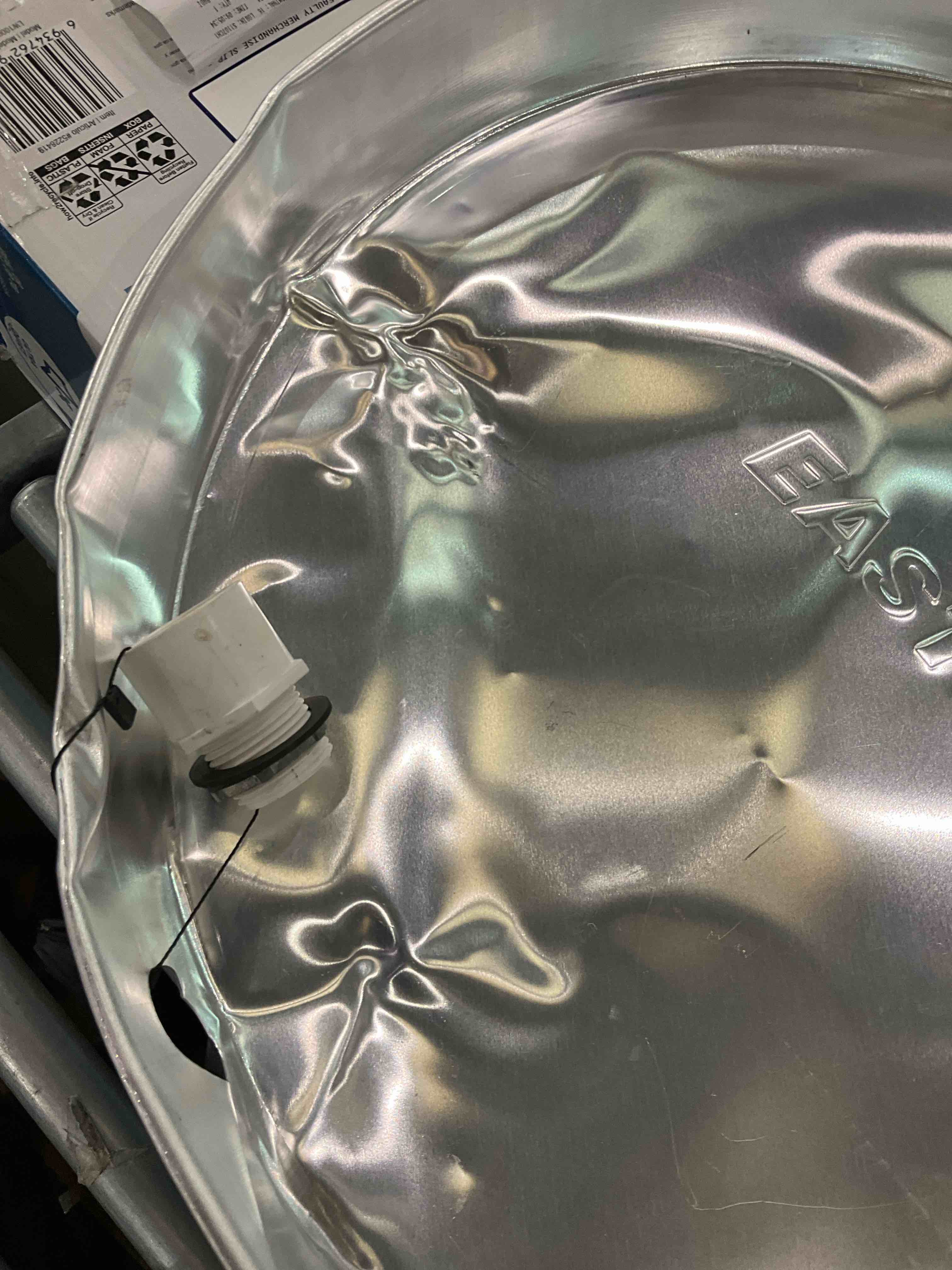 Condition photo showing As Is for water heater pan