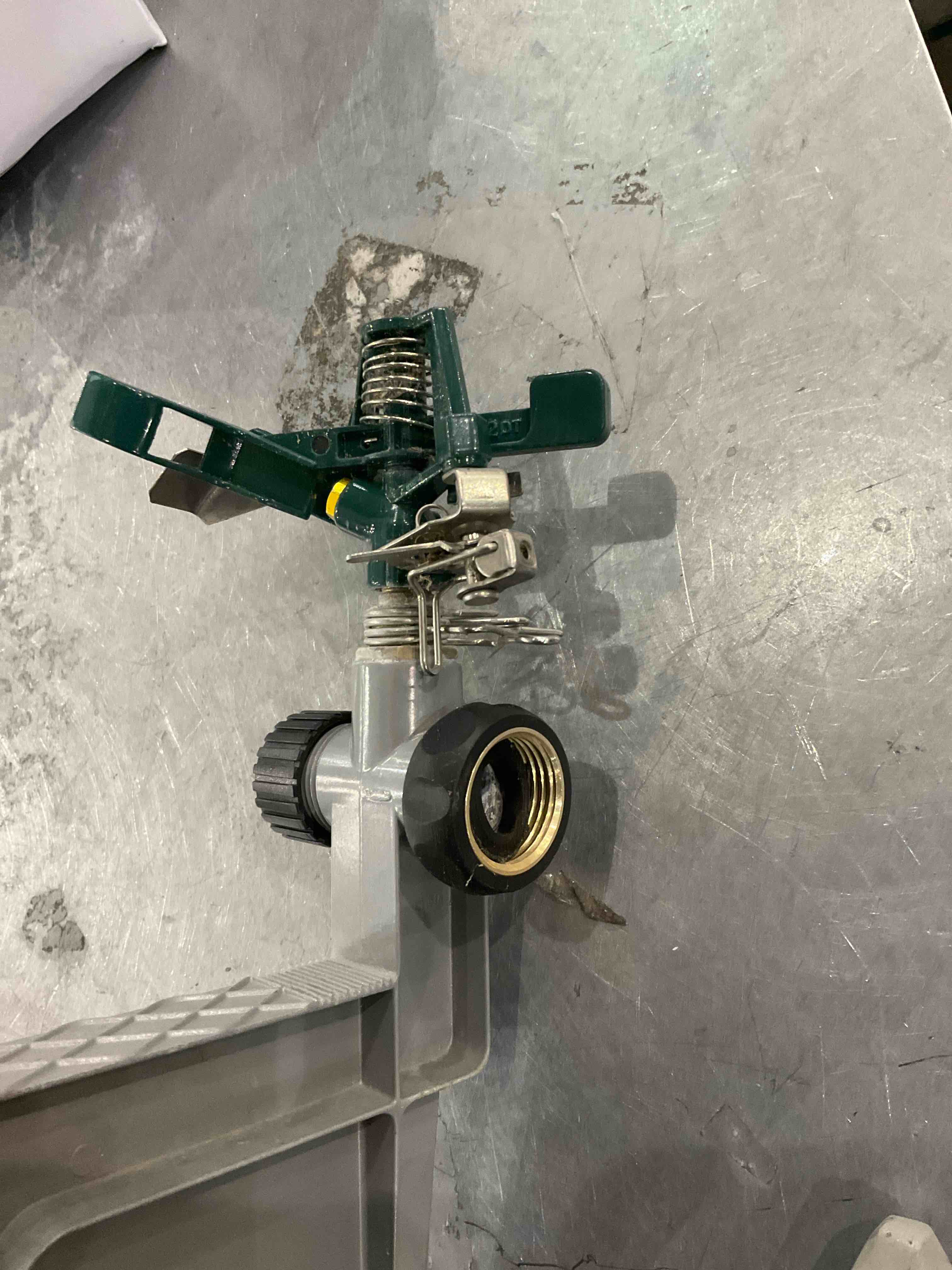 Condition photo showing As Is for sprinkler