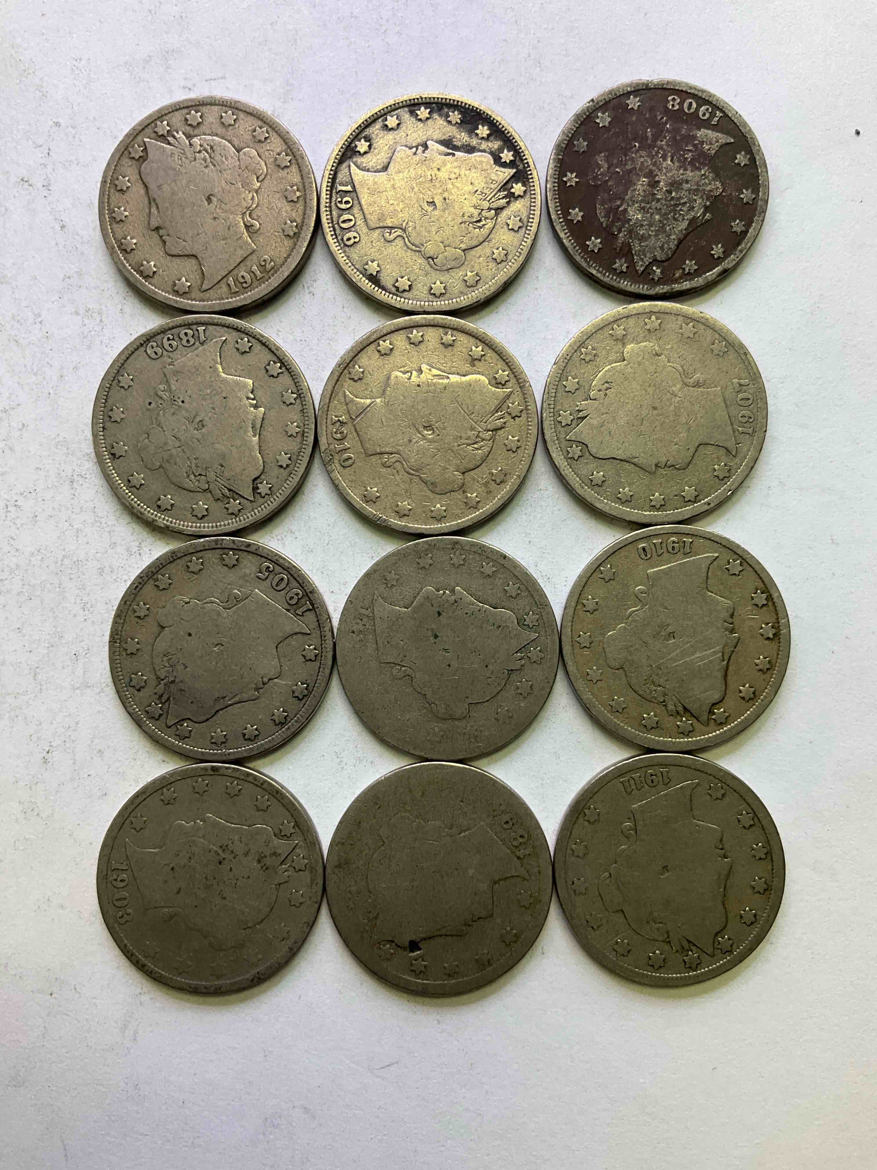 Antique U.S. "V" Nickels, 1912 Year Of The Titanic! Nearly Impossible To Collect! Antique V Nickels, Includes At Least One 1912, The Year Of The Sinking Of The Titanic! Own A Piece Of History Great For Coin Collectors, Think Of The History These Coins Have Seen! Liberty Head V Nickels Were Minted Up Until 1913 & Were The Style Of Nickels Before Buffalo Nickels. Own Some Cool Pieces Of History! Rare To See These Coins With The "Date On" In Circulated Condition!