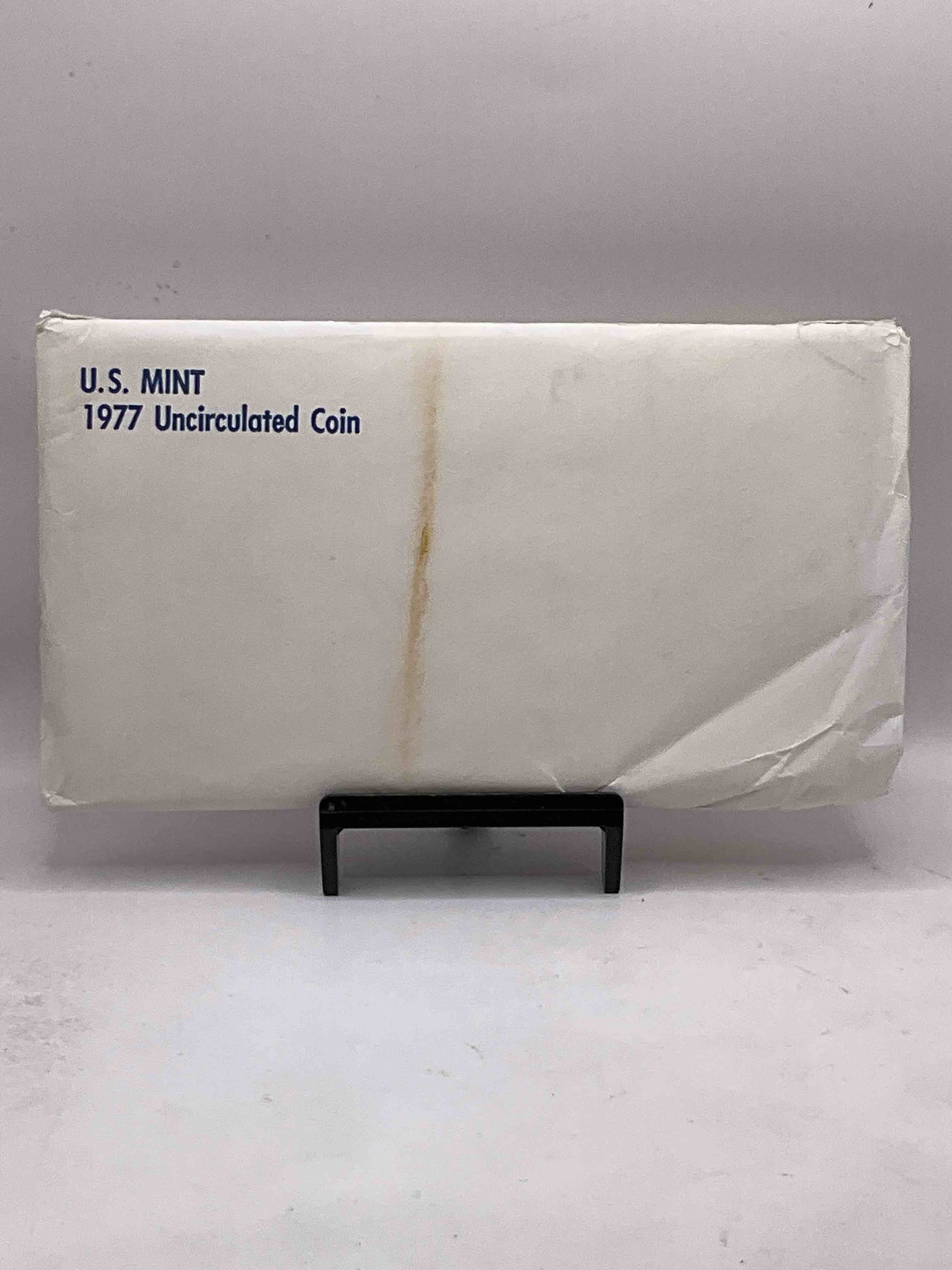 1977 U.S. Mint Set, "May The Force Be With You," The Year Of The Original Star Wars! This Highly Collectible Mint Set Includes 10 Coins, Five Minted From Each Mint Location (Philly & Denver) That Year. Includes "Ike" Dollars! Still In Its Original Envelope Direct From The U.S. Treasury in 1977!