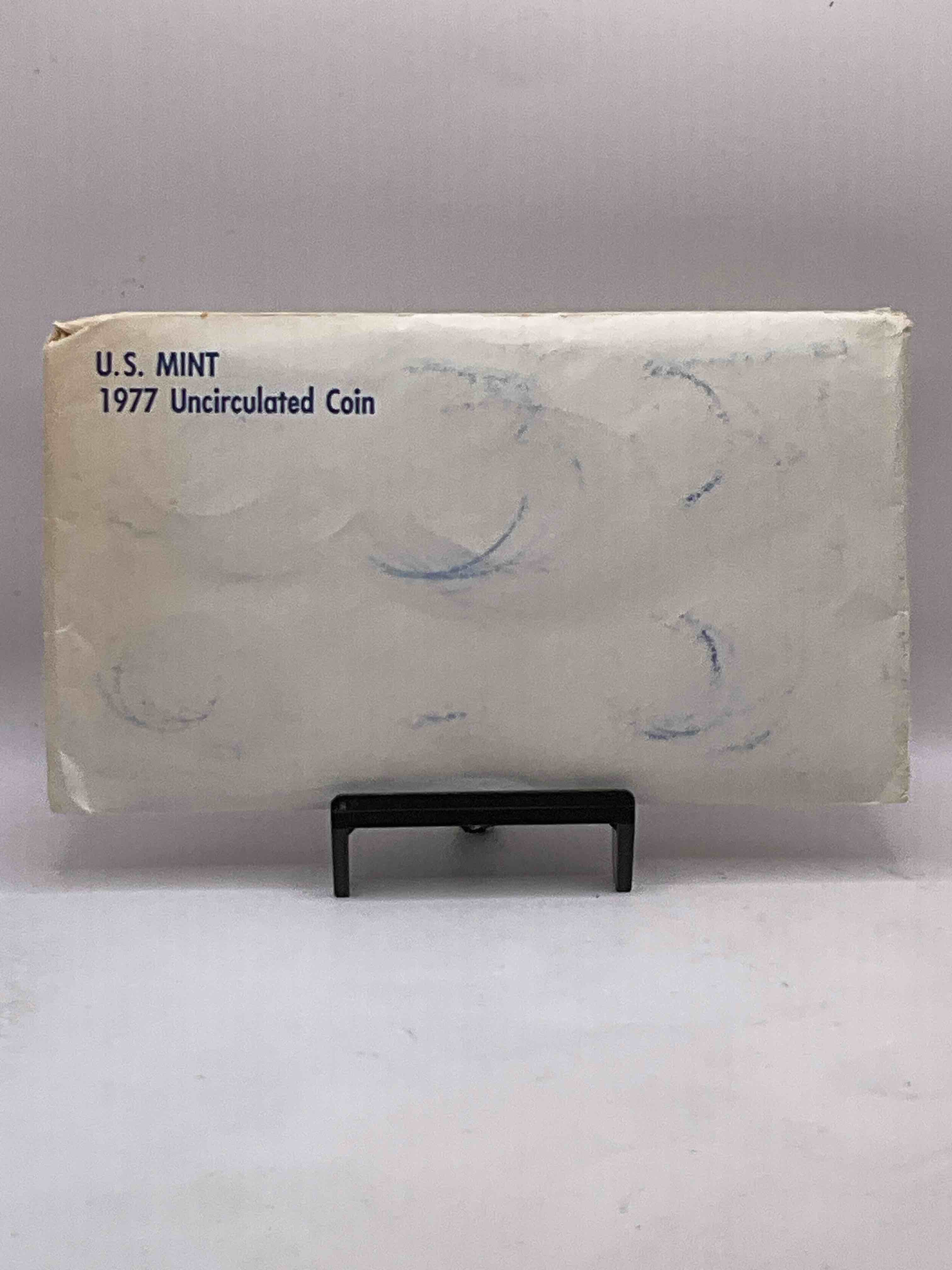 1977 U.S. Mint Set, "May The Force Be With You," The Year Of The Original Star Wars! This Highly Collectible Mint Set Includes 10 Coins, Five Minted From Each Mint Location (Philly & Denver) That Year. Includes "Ike" Dollars! Still In Its Original Envelope Direct From The U.S. Treasury in 1977!