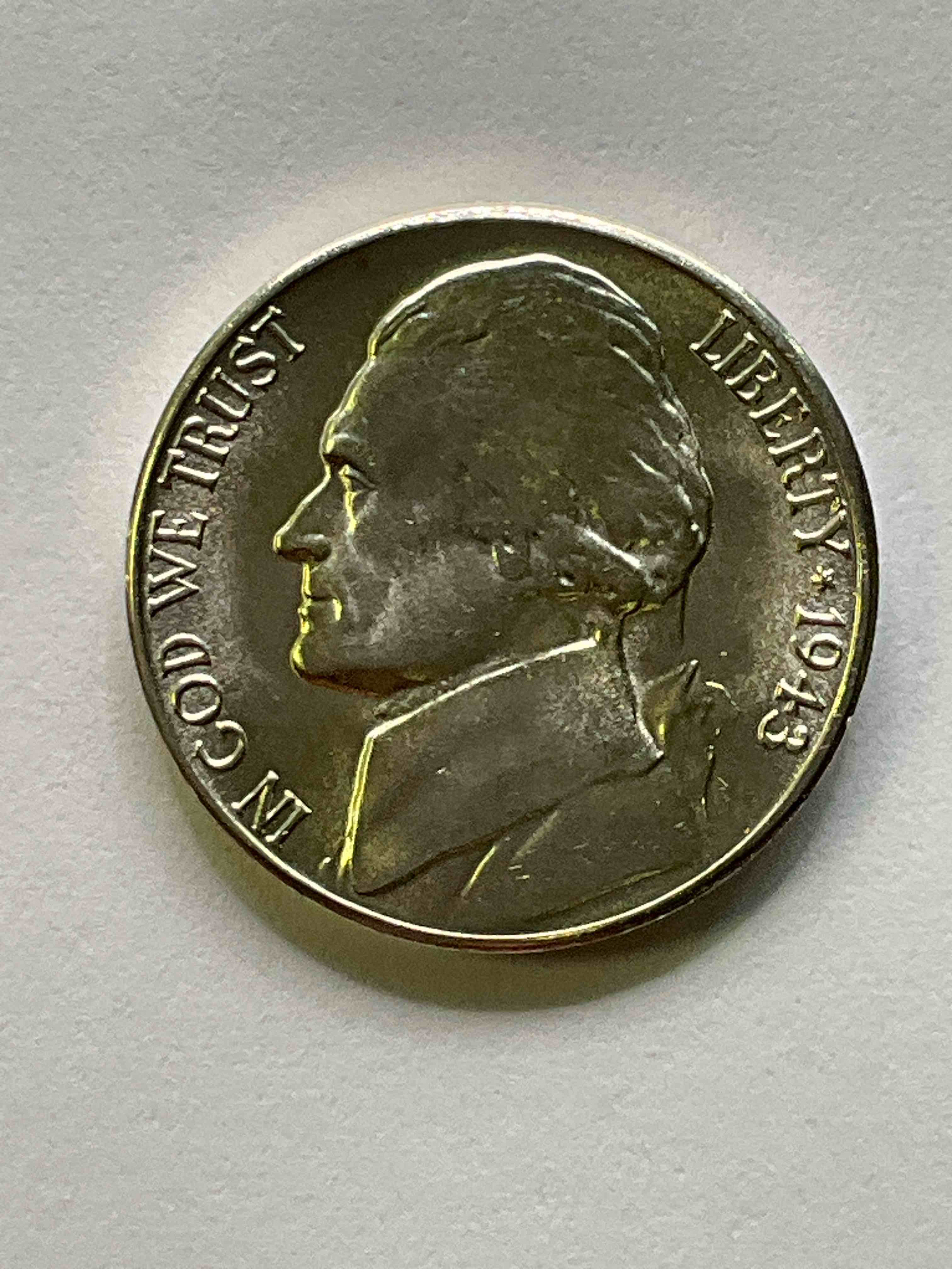 1943 World War II Uncirculated U.S. Silver! Did You Know That Nickels Were Actually Made Of Silver During World War II From 1942-45? This Is Because America Needed Nickel To Make Ammunition, So The U.S. Treasury Made Nickels Out Of Partial Silver Instead Of Nickel For These Three Years Only! Here Is An Awesome Example Of An Uncirculated, Pristine 1945 Silver Nickel! Own A Rare Piece Of Valuable World War II Precious Metal History! VERY Hard To Find!