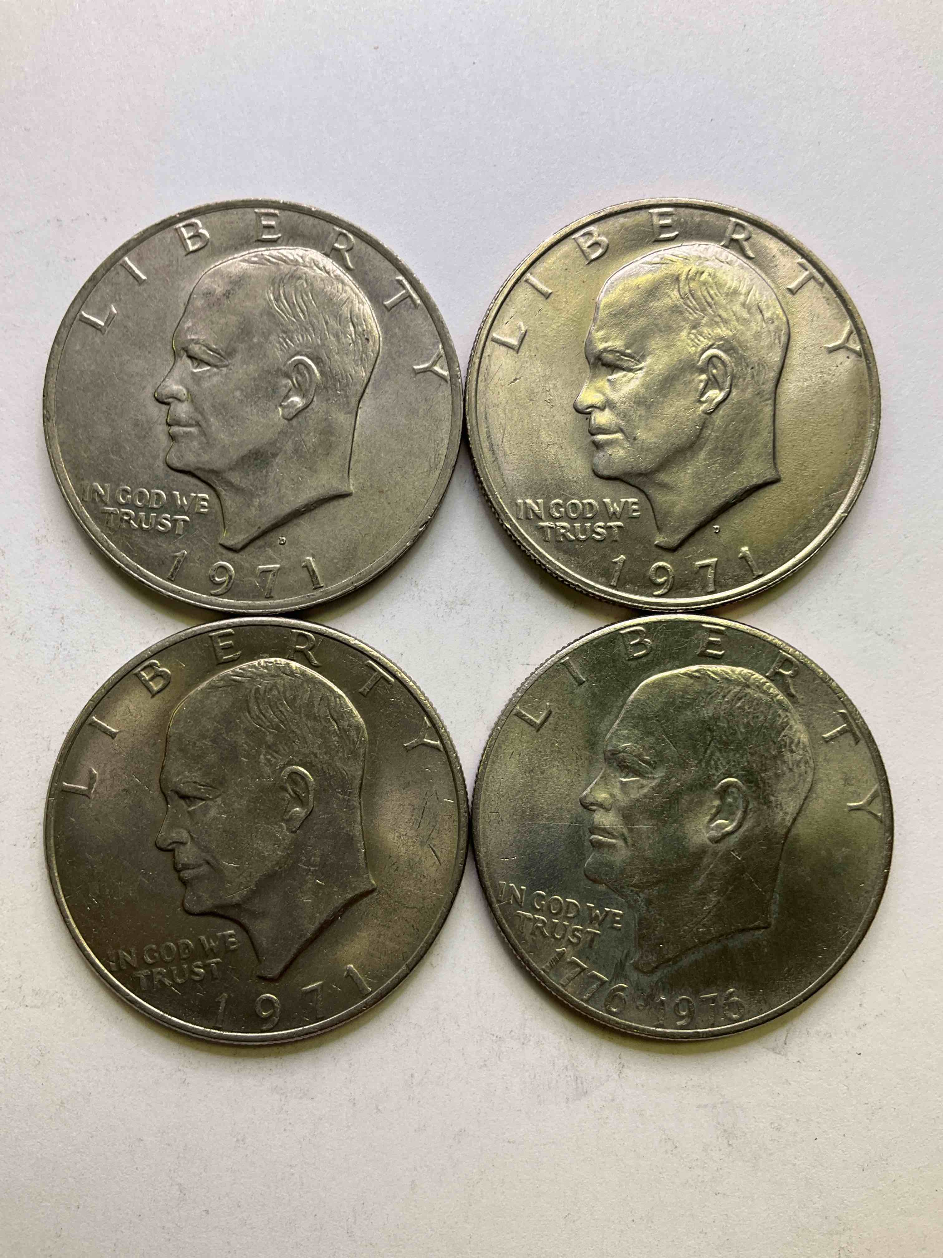 Eisenhower Dollar Coins, With A Bicentennial Coins! These Striking, Large U.S. Coins Were Minted From 1971-1978. Here Are Gorgeous Examples Of "Ike" Dollars In Varying Years. These Coins Have Become Immensely Popular With Collectors & Some Have Great Toning!