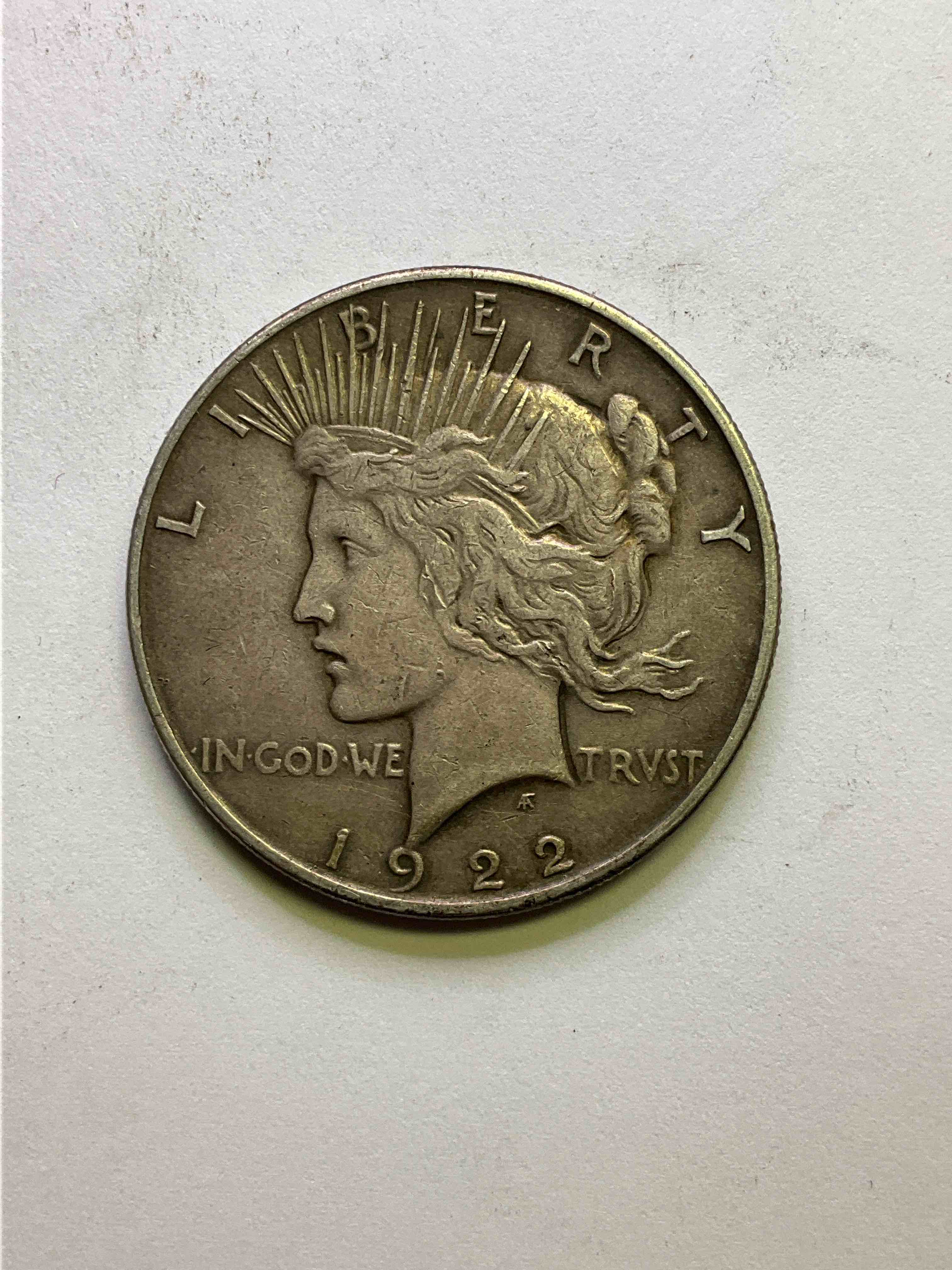 1922 Silver Peace Dollar US Coin! Silver Peace Dollars Were Produced From 1921-1935 To Commemorate The End Of World War One. This Large, 1.5" Diameter, Heavy, Gorgeous Coin Is 90% Silver & 10% Copper, Giving It A Net Weight of .77344 oz. Of Pure Silver! Own A Valuable Piece Of History & An Incredible Investment In Precious Metals!