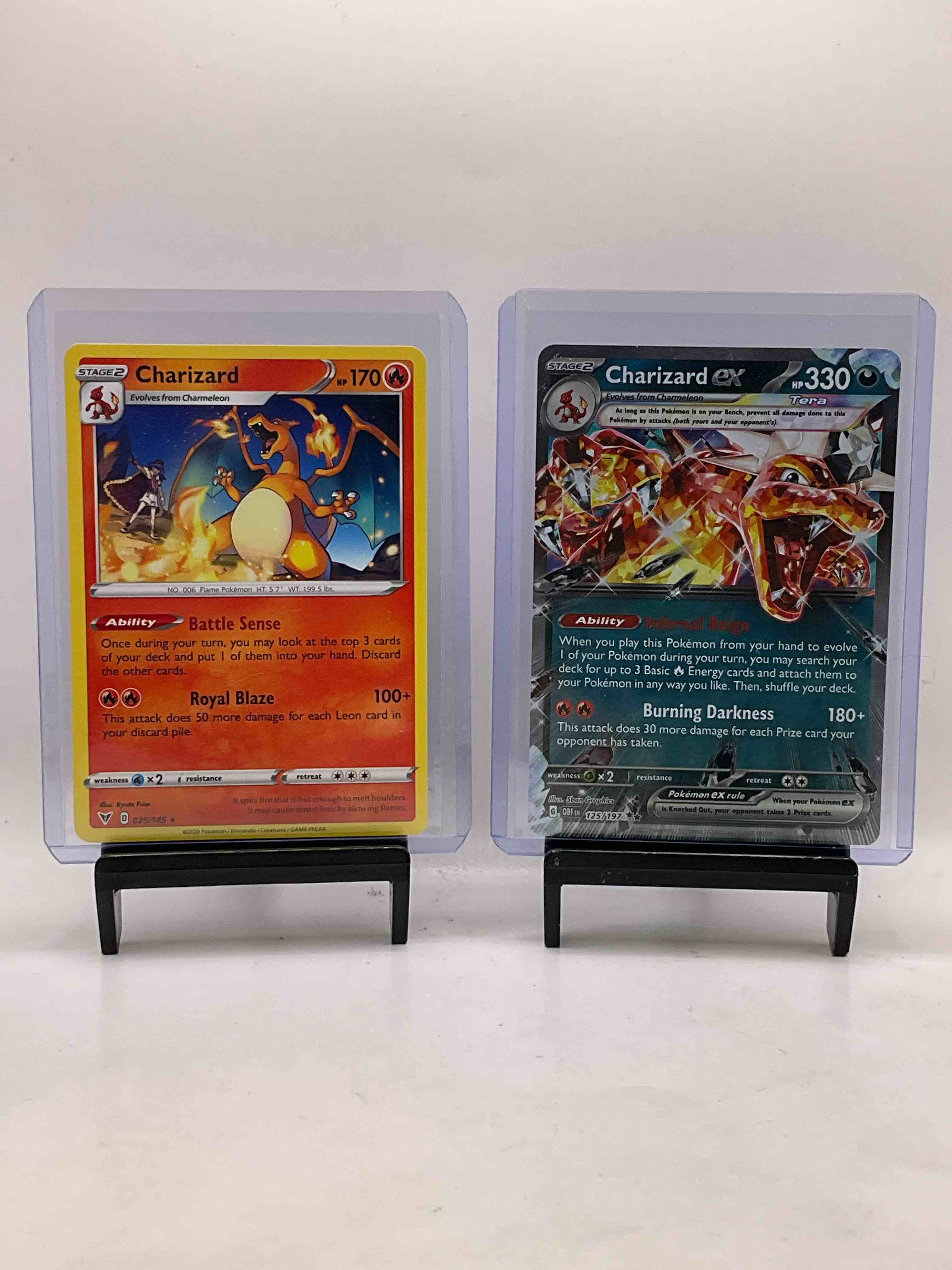 Pokémon Cards Galore! Check Out This Awesome Collection Of 50 Pokémon Cards, Includes 2023 Burning Darkness Charizard Holofoil, 2020 Charizard Royal Blaze Holofoil & Many Other Awesome Cards Including Many Holofoils! Get Into The Craze!