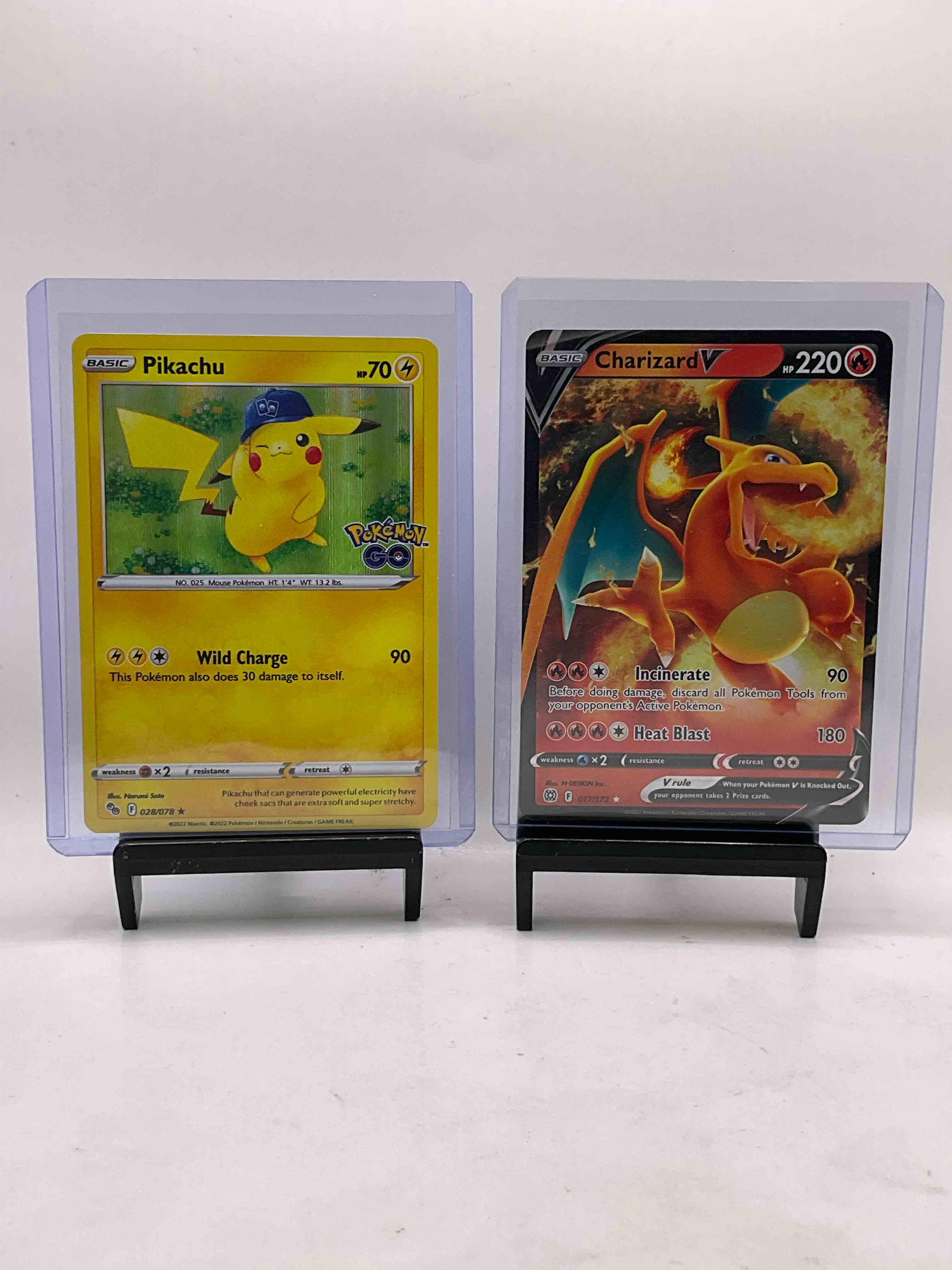 Pokémon Cards Galore! Check Out This Awesome Collection Of 50 Pokémon Cards, Includes Highly Desirable 2022 Incinerate / Heat Blast Charizard Holofoil, 2022 Pikachu Wild Charge Holo & Many Other Awesome Cards Including Many Holofoils! Get Into The Craze!