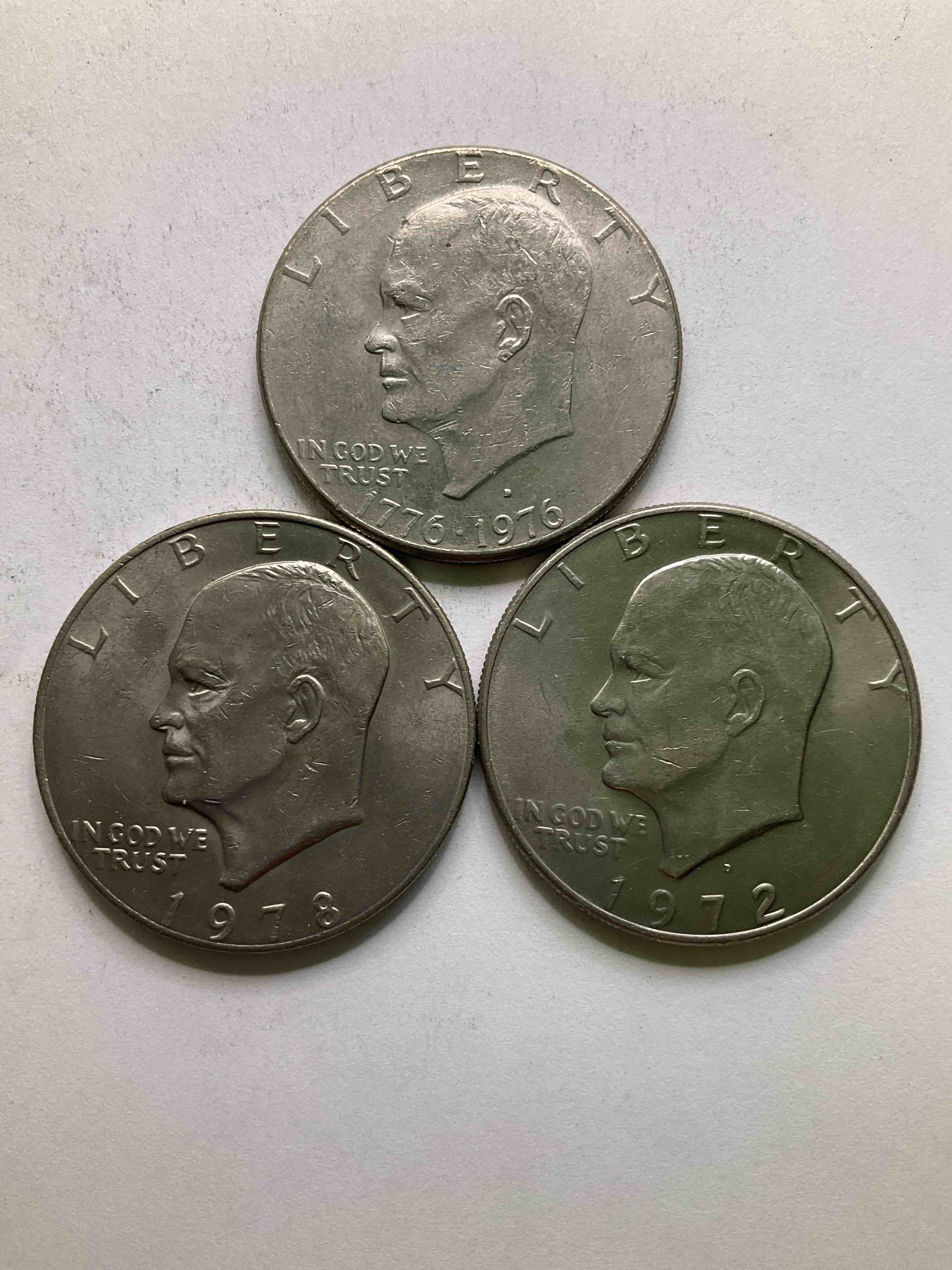 Eisenhower Dollars! Including 1976 Bicentennial Bliss! In 1976 The U.S. Mint Produced Coins Celebrating The 200 Year Anniversary Of America. Up For Auction Are Three Ike Dollars...  Including The Infamous Ike Dollar & 200 Year Anniversary Edition! Highly Desirable For Collectors! Own Pieces Of History & Get Ready For America's 250 Year Anniversary Coming Soon!