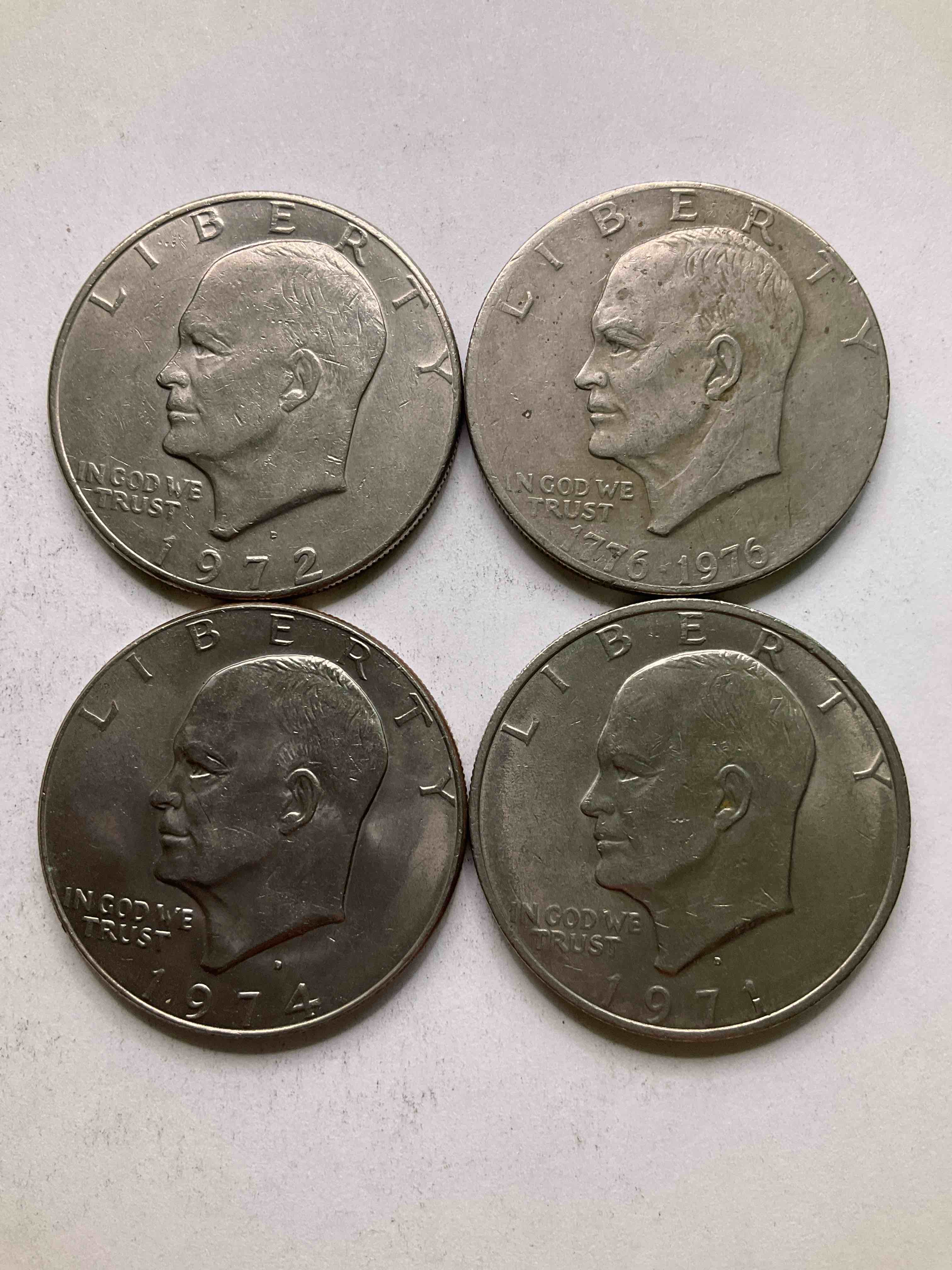 Eisenhower Dollars! Including 1976 Bicentennial Bliss! In 1976 The U.S. Mint Produced Coins Celebrating The 200 Year Anniversary Of America. Up For Auction Are Four Ike Dollars...  Including The Infamous Ike Dollar & 200 Year Anniversary Edition! Highly Desirable For Collectors! Own Pieces Of History & Get Ready For America's 250 Year Anniversary Coming Soon!