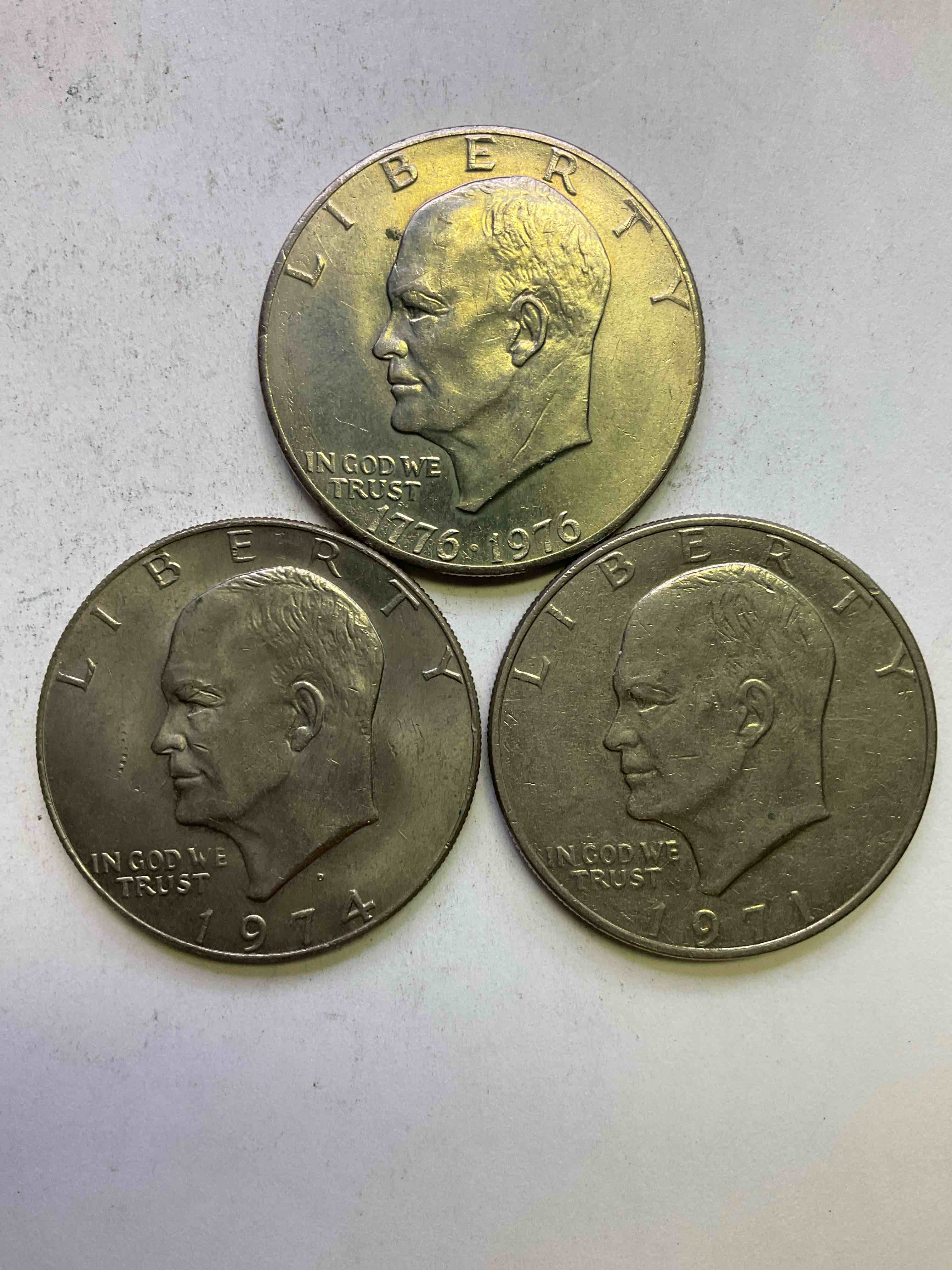 Eisenhower Dollars! Including 1976 Bicentennial Bliss! In 1976 The U.S. Mint Produced Coins Celebrating The 200 Year Anniversary Of America. Up For Auction Are Three Ike Dollars...  Including The Infamous Ike Dollar & 200 Year Anniversary Edition! Highly Desirable For Collectors! Own Pieces Of History & Get Ready For America's 250 Year Anniversary Coming Soon!