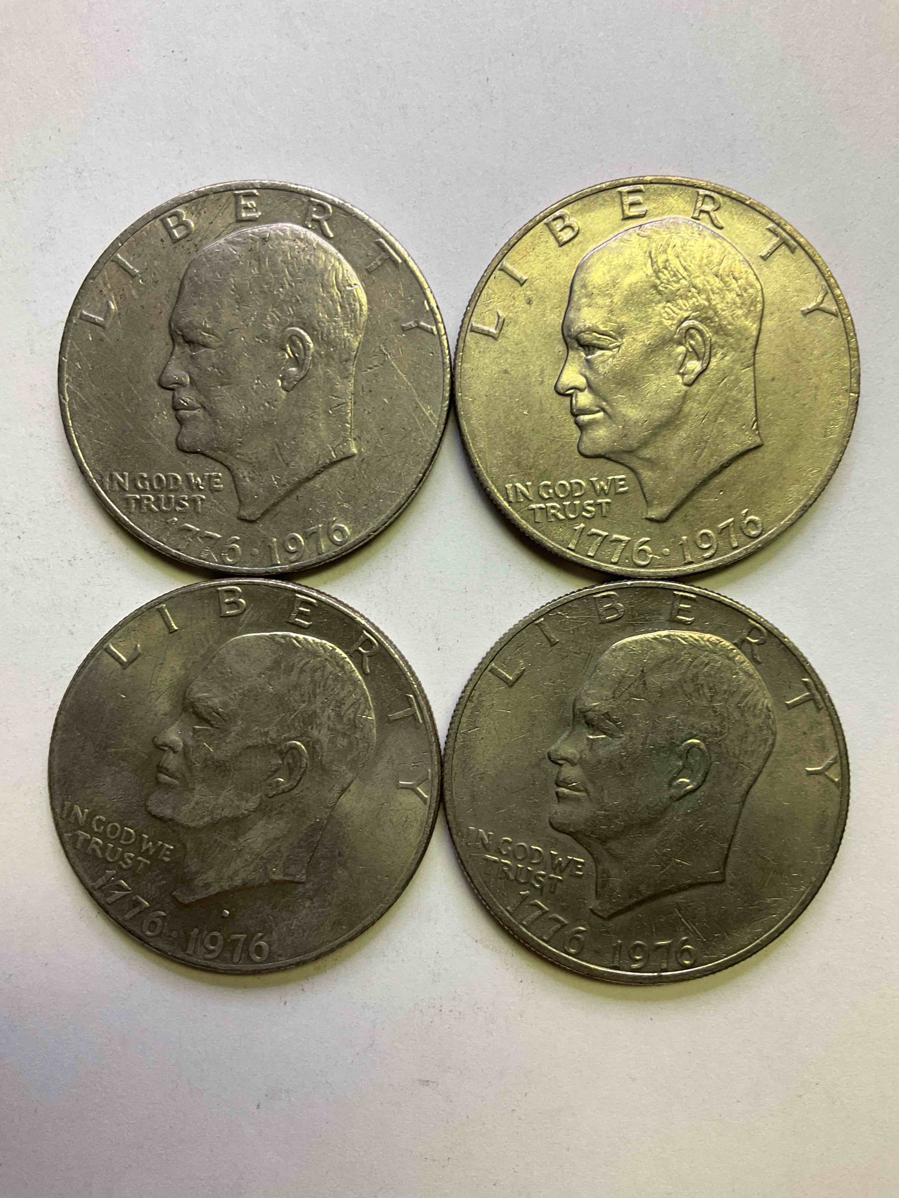 Eisenhower Dollars! Including 1976 Bicentennial Bliss! In 1976 The U.S. Mint Produced Coins Celebrating The 200 Year Anniversary Of America. Up For Auction Are Four Ike Dollars...  Including The Infamous Ike Dollar & 200 Year Anniversary Edition! Highly Desirable For Collectors! Own Pieces Of History & Get Ready For America's 250 Year Anniversary Coming Soon!