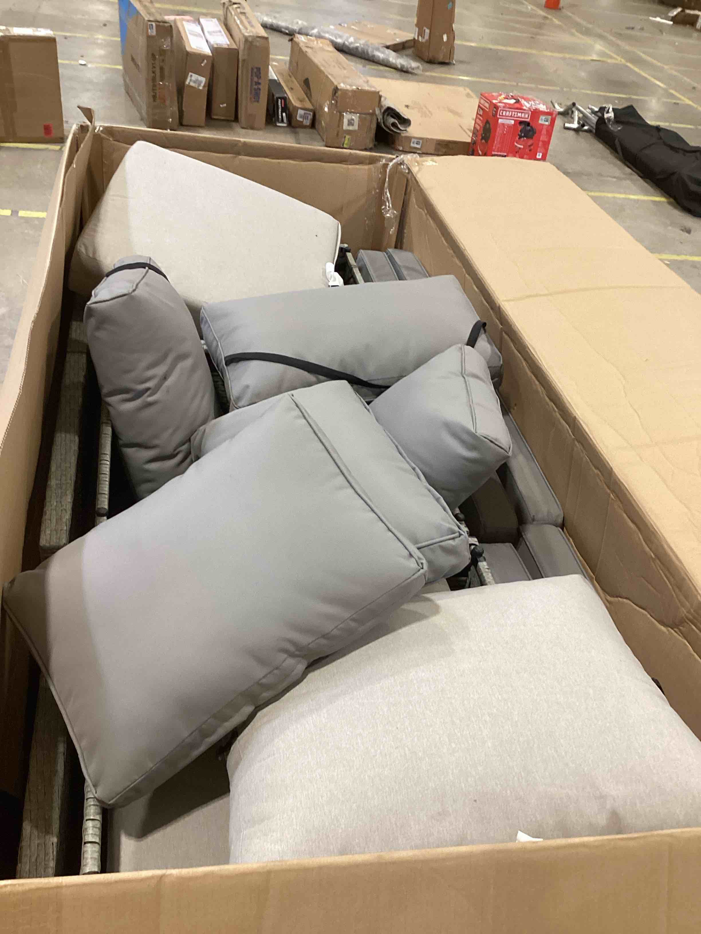 Condition photo showing As Is for signature design by ashley brook ranch outdoor sectional, all?weather resin wicker patio furniture with high?performance cushions, durable aluminum frame, neutral sectional and bench