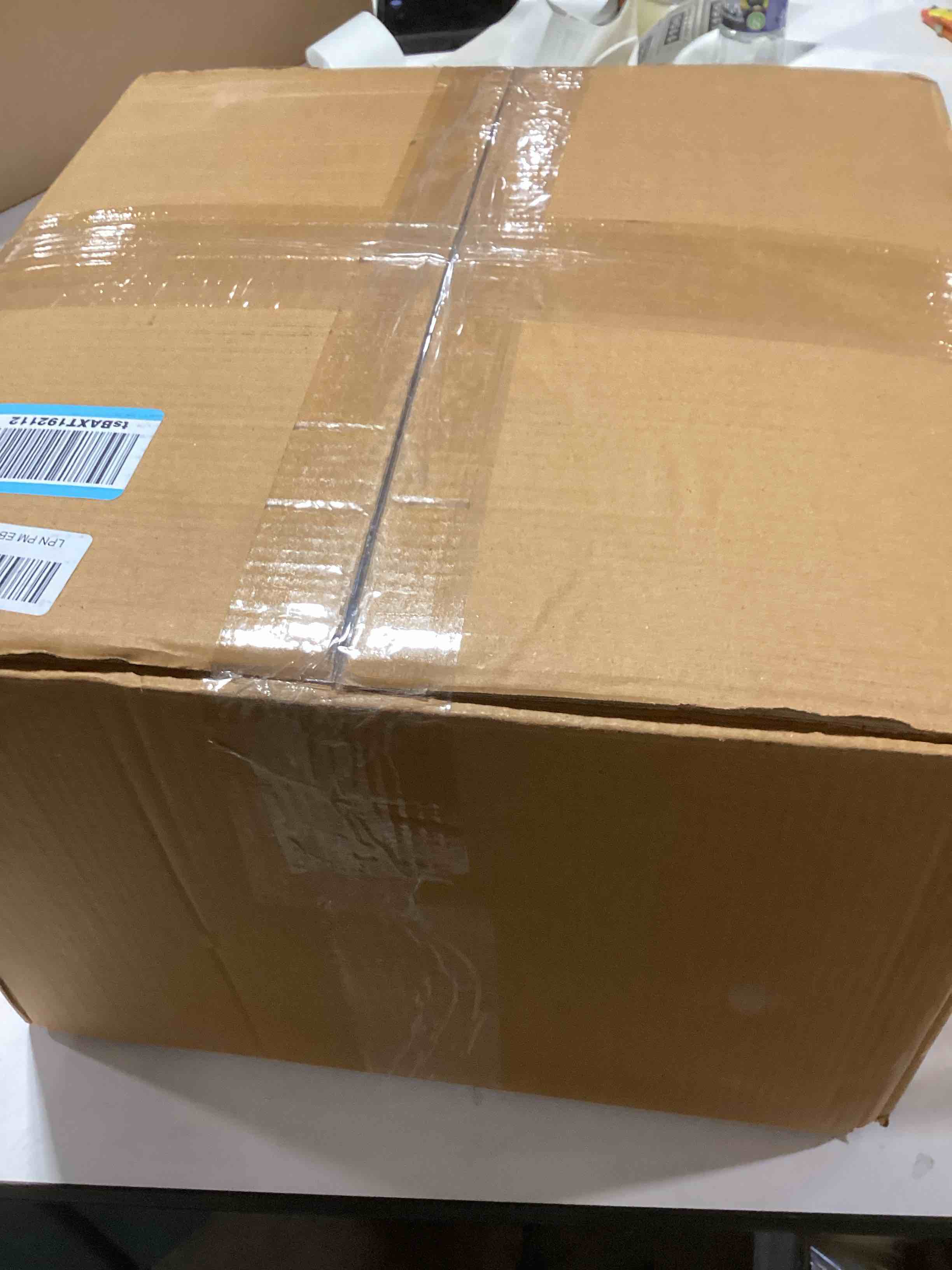 Condition photo showing As Is for S & L Homes Pouf Ottoman - 100% Jute Braided Footrest Pouf Hand Knitted Traditional Cord Boho Pouffe for Living Room, Bedroom, Nursery, Patio, Lounge Colorblock - Natural Brown (18”x18”x12”) Brown 18"x18"x12"