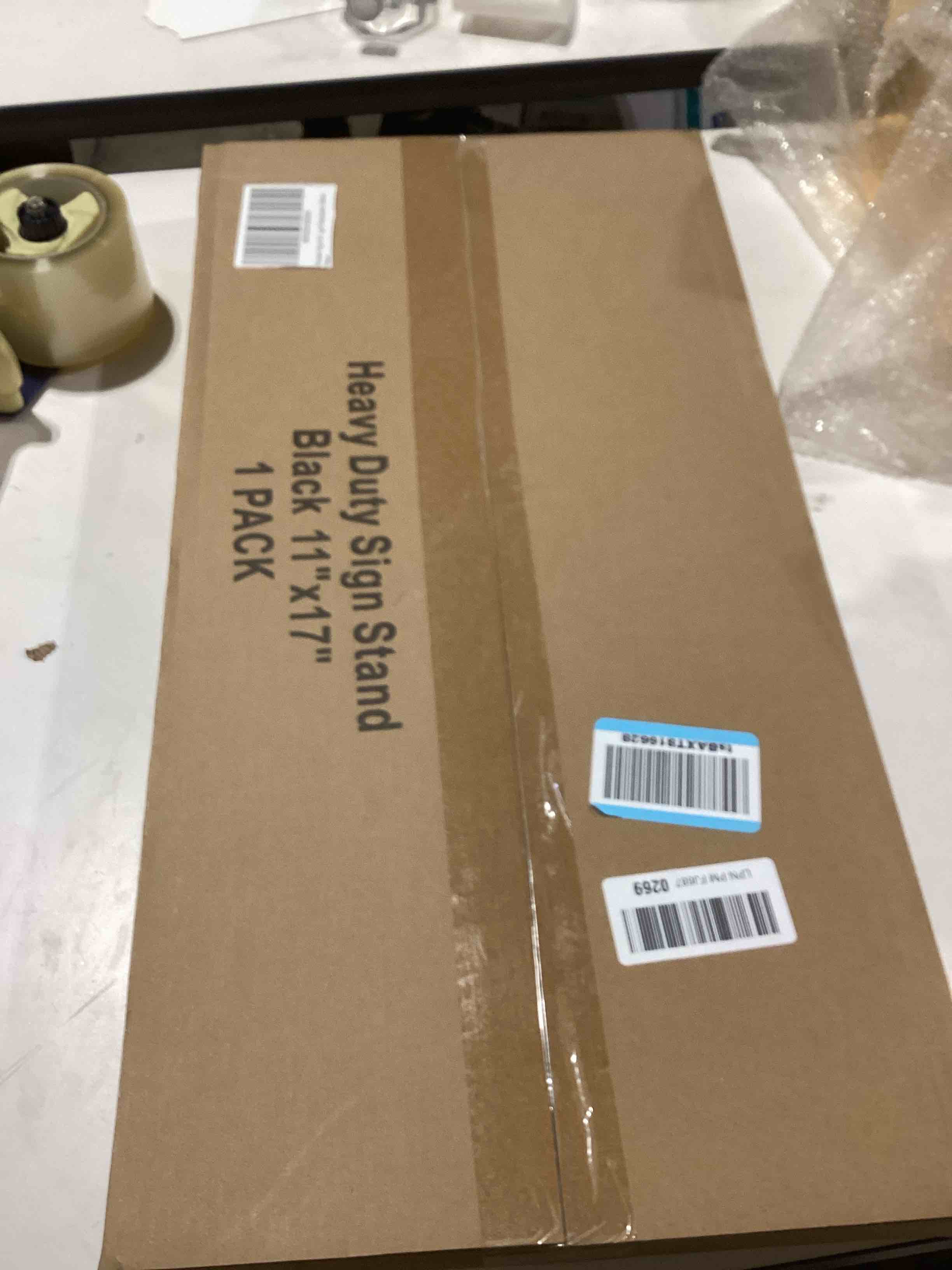Condition photo showing As Is for Sign Holder 8.5x11 inch-Adjustable Sign Stand for Display, Floor Standing Sign Holder Stand, Pedestal Heavy Duty Poster Stand with Round Base for Display, Advertisement, and Outdoor (1Pack) Black 8.5 x 11 Inches