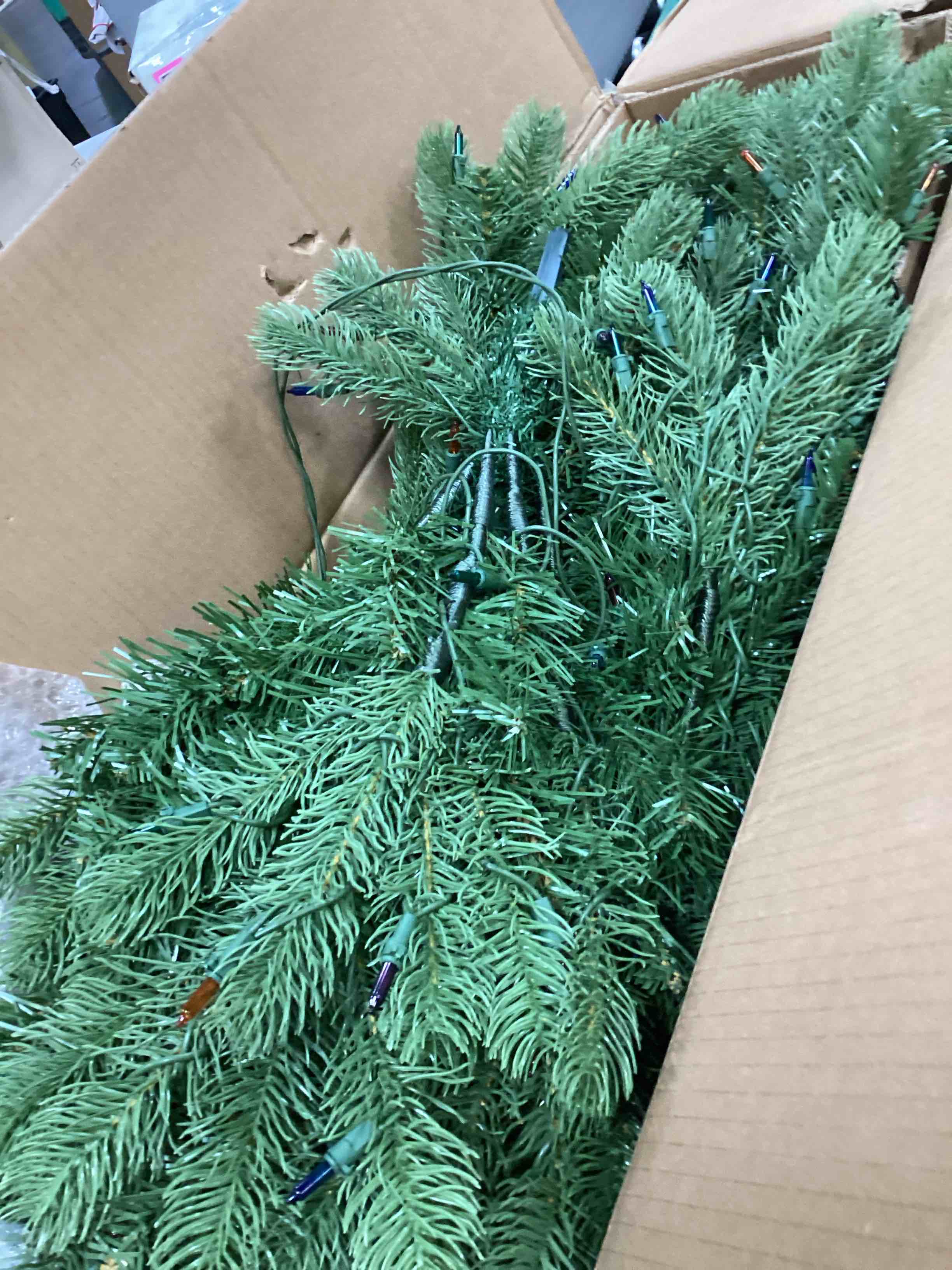 Condition photo showing As Is for National Tree Company 4.5 ft Pre-Lit Downswept Douglas Fir Artificial Christmas Tree, 450 Multicolor Lights, 525 Feel Real Tips, Includes Stand, Green 4ft 6in With 450 Multicolor Lights