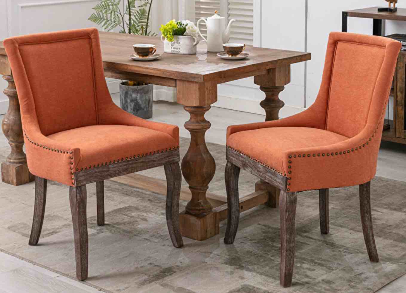 W807 orange fabric dining chairs with neutrally toned solid wood legs bronze nailhead, set of 2